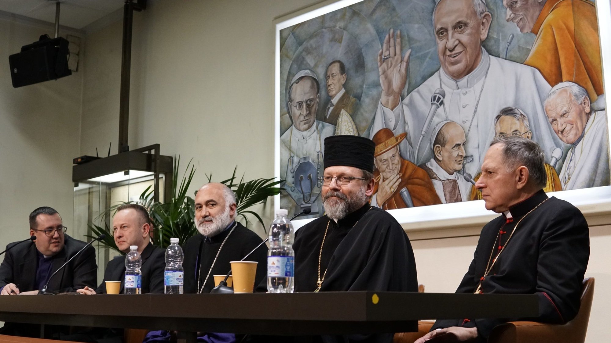 Members of the Ukrainian Council of Churches and Religions speak at a news conference at the Vatican Jan. 26, 2023. From the right: Archbishop Mieczyslaw Mokrzycki of Lviv; Archbishop Sviatoslav Shevchuk of Kyiv-Halych, head of the Ukrainian Catholic Church; Bishop Marcos Hovhannisyan of the Ukrainian Diocese of the Armenian Apostolic Church; Valerii Antoniuk, head of the All-Ukrainian Union of the Churches of Evangelical Christians-Baptists; and a translator. (CNS photo/Justin McLellan)