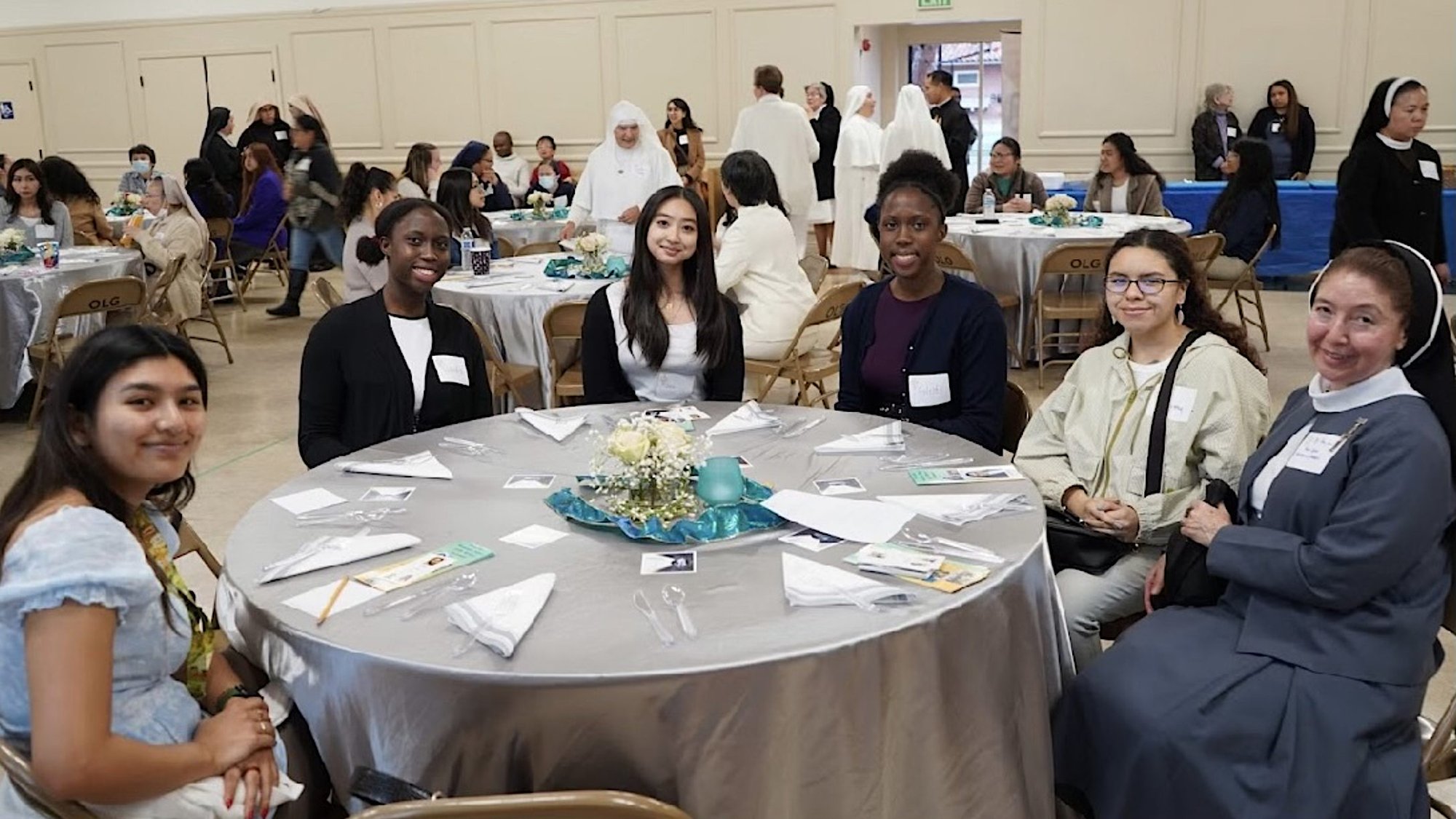 Sister Ana Lidia Gonzales, right, sits with participants -- including Cassandra Verma, left -- during the Miriam Dinner, which provided young women with an opportunity to consider religious life, at Our Lady of Grace Church in Encino on March 18. (Submitted photo)