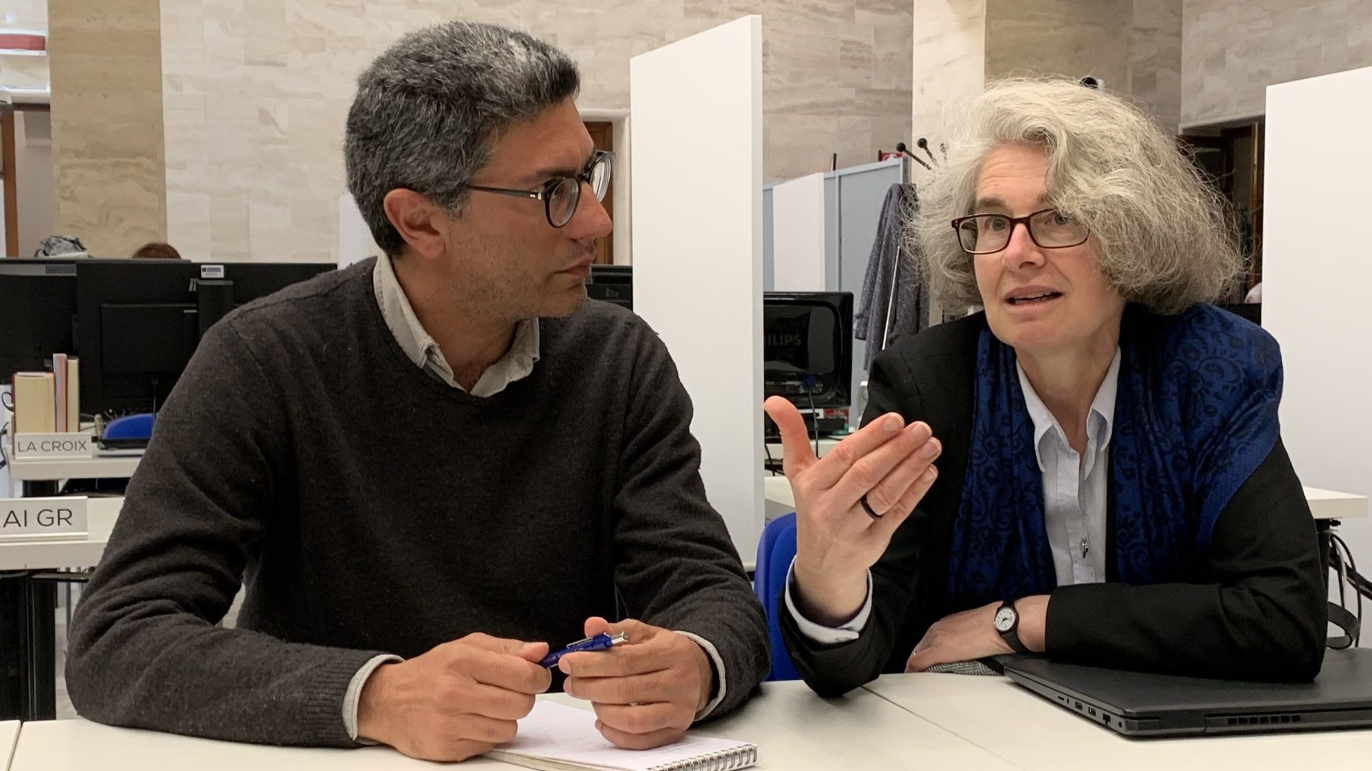 Xavière Missionary Sister Nathalie Becquart, undersecretary of the Synod of Bishops, speaks to Iacopo Scaramuzzi, a reporter for La Repubblica, in the Vatican press office April 26, 2023. The Vatican had just announced Pope Francis' decision to have women and laymen as voting members of the synod. (CNS photo/Cindy Wooden)