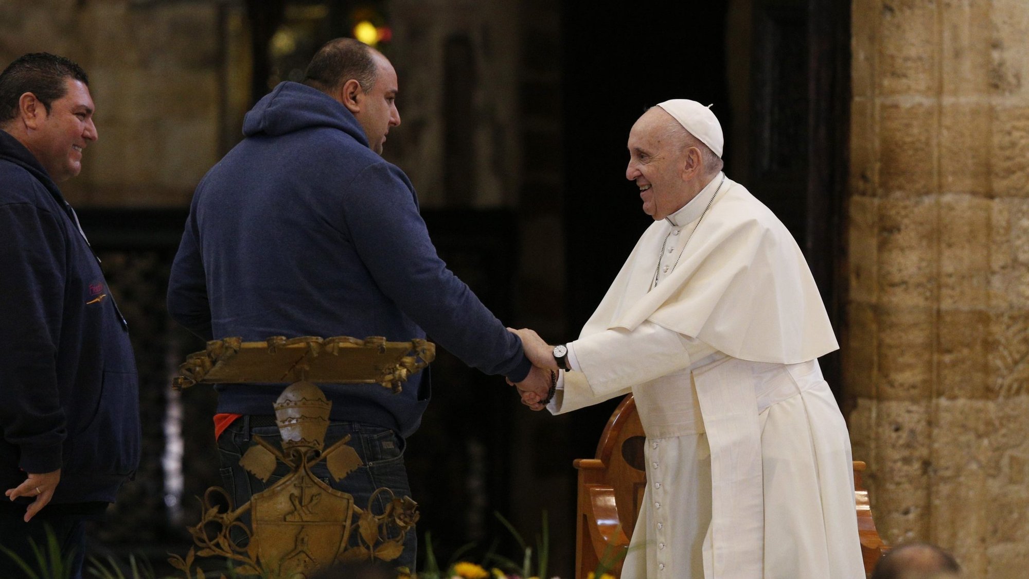 Pope Francis greets a man who spoke during a meeting with the poor at the Basilica of St. Mary of the Angels in Assisi, Italy, Nov. 12, 2021. The visit was in preparation for the celebration of the World Day of the Poor. (CNS photo/Paul Haring)