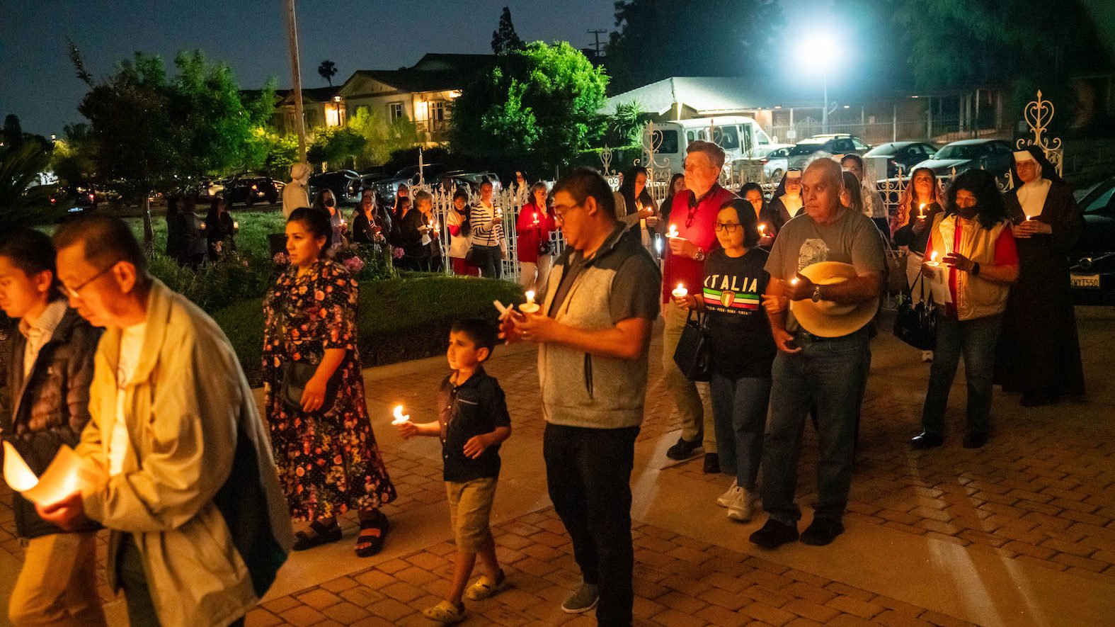 Families with children were among the hundreds who turned out for the Carmelite Sisters of the Most Sacred Heart of LA’s “Reclaim Hope: A Sacred Heart Celebration” at Santa Teresita Chapel in Duarte on June 16. The event, held the same night that the LA Dodgers honored a controversial group of drag “sisters” with a history of anti-Catholic rhetoric, included Mass, dinner, adoration, and a candlelight eucharistic procession. (John Rueda)