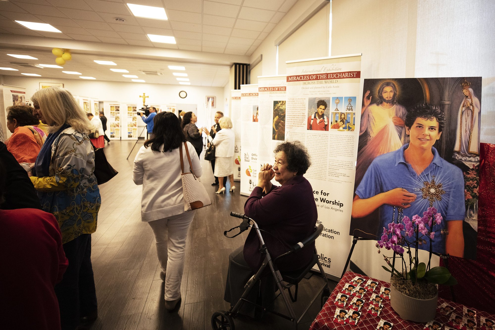Visitors check out the exhibit on Eucharistic miracles at Christ the King Church near Hollywood on June 11, the day it opened. (Victor Alemán)