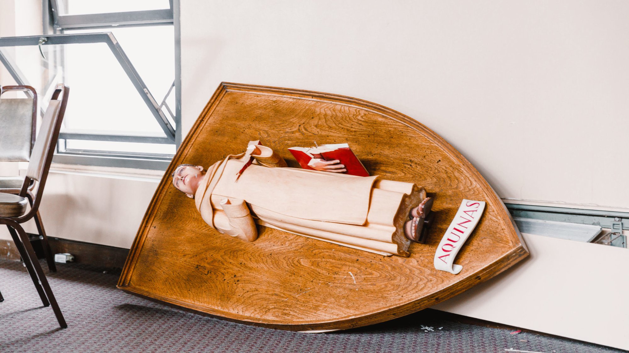 A statue of St. Thomas Aquinas came down in the dining hall at Thomas Aquinas College during a 5.1 earthquake on Sunday, Aug. 20. (Liam McDaniel/Thomas Aquinas College)