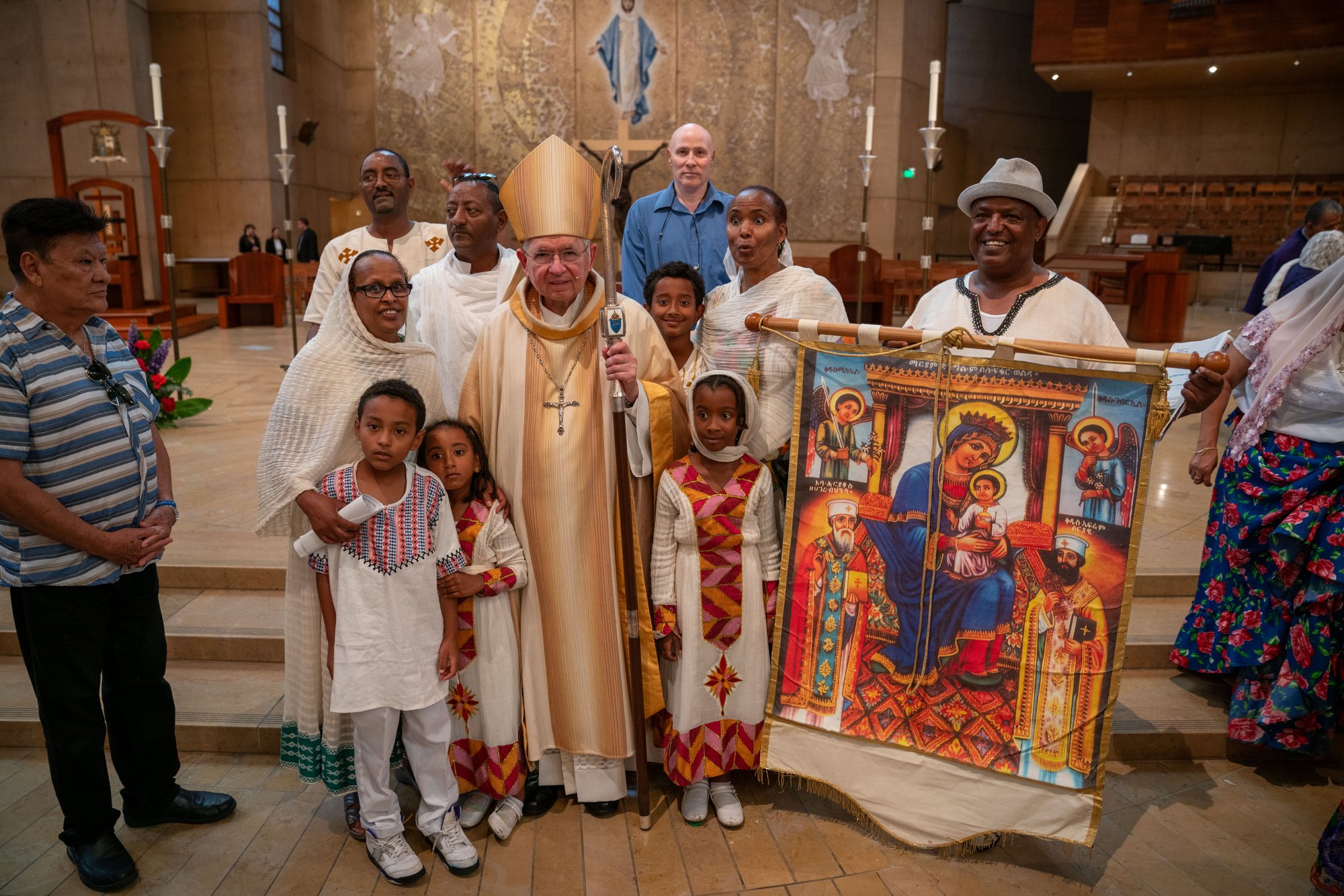 Archbishop Gomez poses with a family at the One Mother, Many Peoples Mass Aug. 26 at the Cathedral of Our Lady of the Angels. (John Rueda)