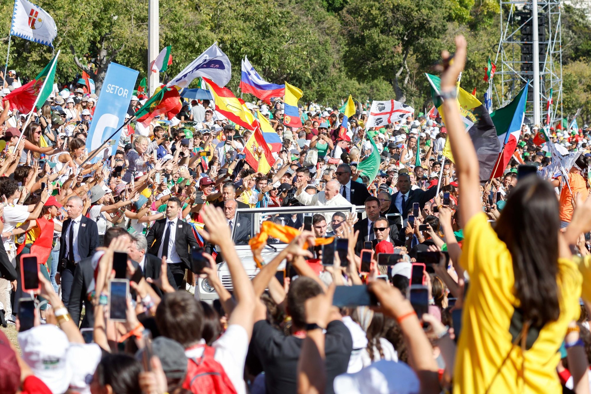 Young people cheer as Pope Francis arrives in the popemobile for the World Youth Day Stations of the Cross with young people at Eduardo VII Park in Lisbon, Portugal, Aug. 4, 2023. (CNS/Lola Gomez)