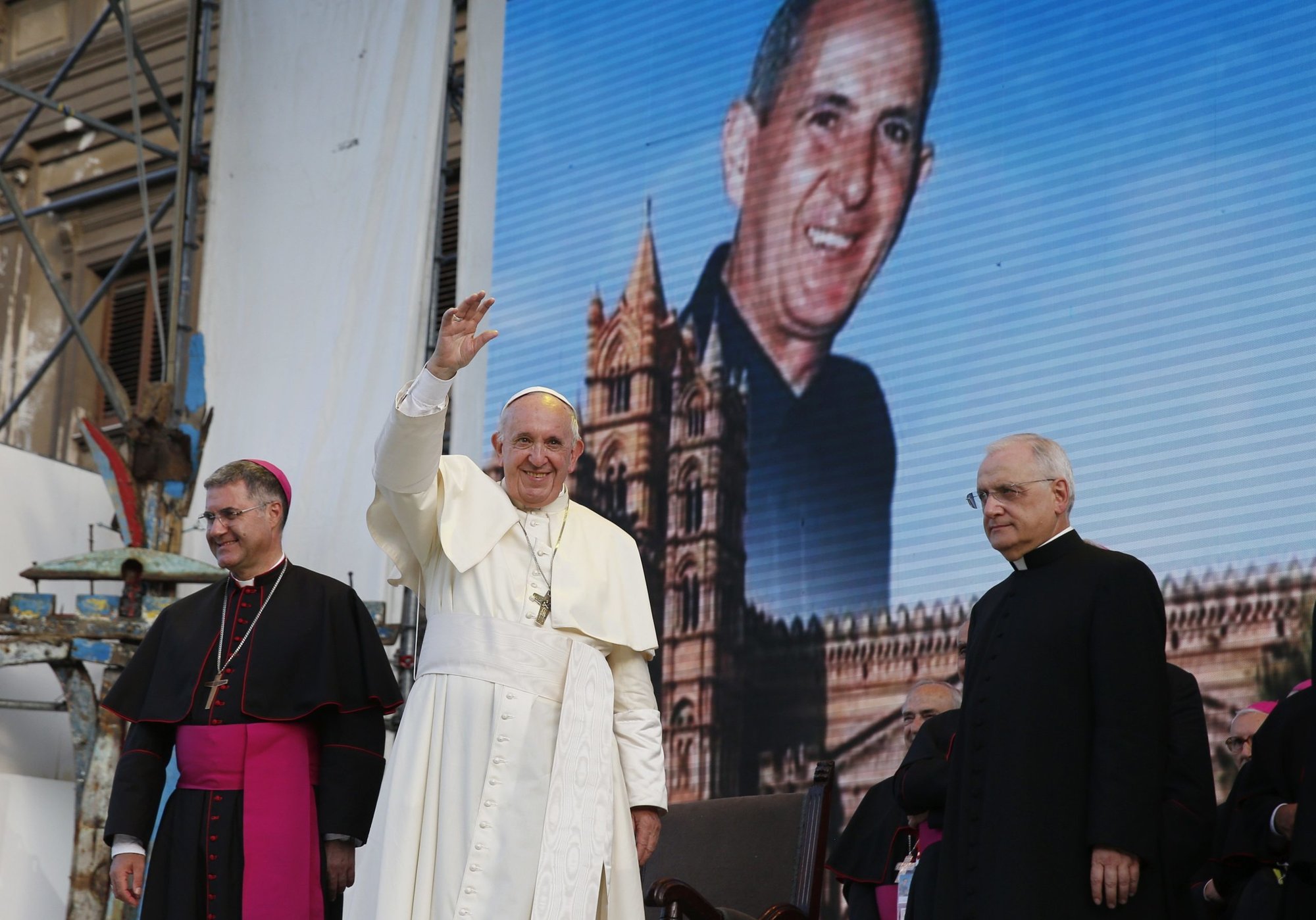 An image of Blessed Pino Puglisi, slain by the Mafia in 1993, is seen as Pope Francis leads a meeting with young people in Palermo, Sicily, in this file photo from Sept. 15, 2018. (CNS/Paul Haring)