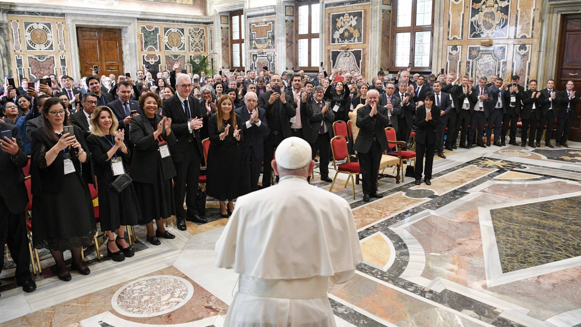 Pope Francis arrives for a meeting with the rectors of public and private universities from Latin America and the Caribbean at the Vatican Sept. 21, 2023. Responding to questions, the pope said his new document on the environment would be called "Laudate Deum" (Praise God). (CNS/Vatican Media)