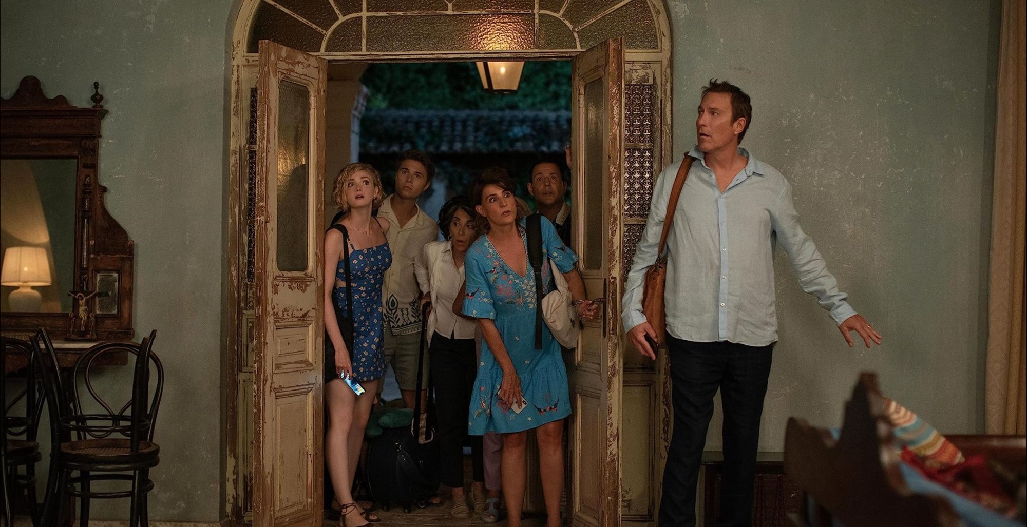 Ian, played by John Corbett (left), with characters from “My Big Fat Greek Wedding 3” in a scene from the 2023 film. (Courtesy of Yannis Drakoulidis - © 2023 Focus Features, LLC)