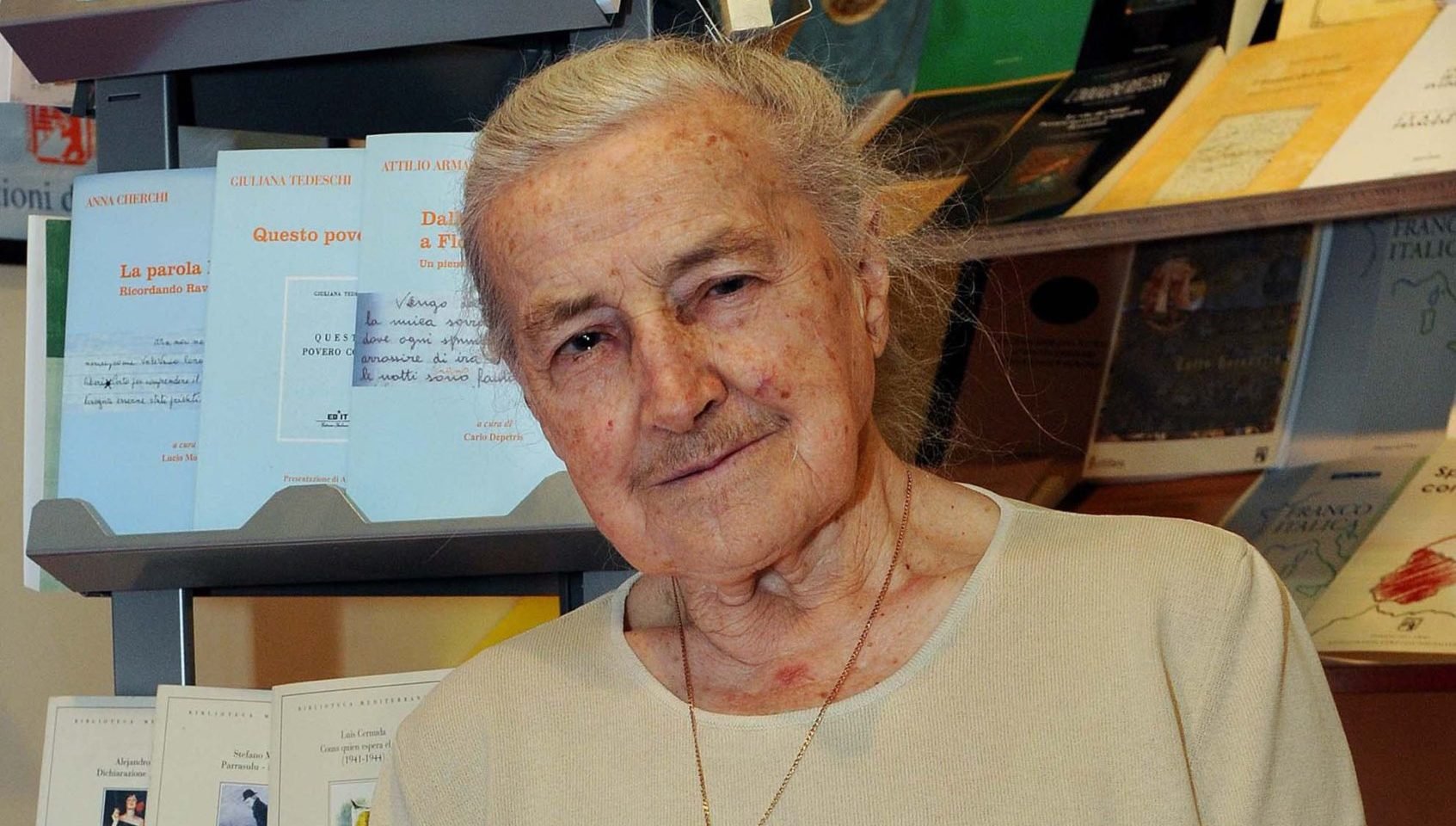 Wanda Poltawska, a longtime friend and adviser to Pope John Paul II, holds a copy of a book she wrote, in a bookstore in Turin, Italy, in this May 12, 2008 file photo. (CNS/Guglielmo Lobera, Catholic Press Photo)