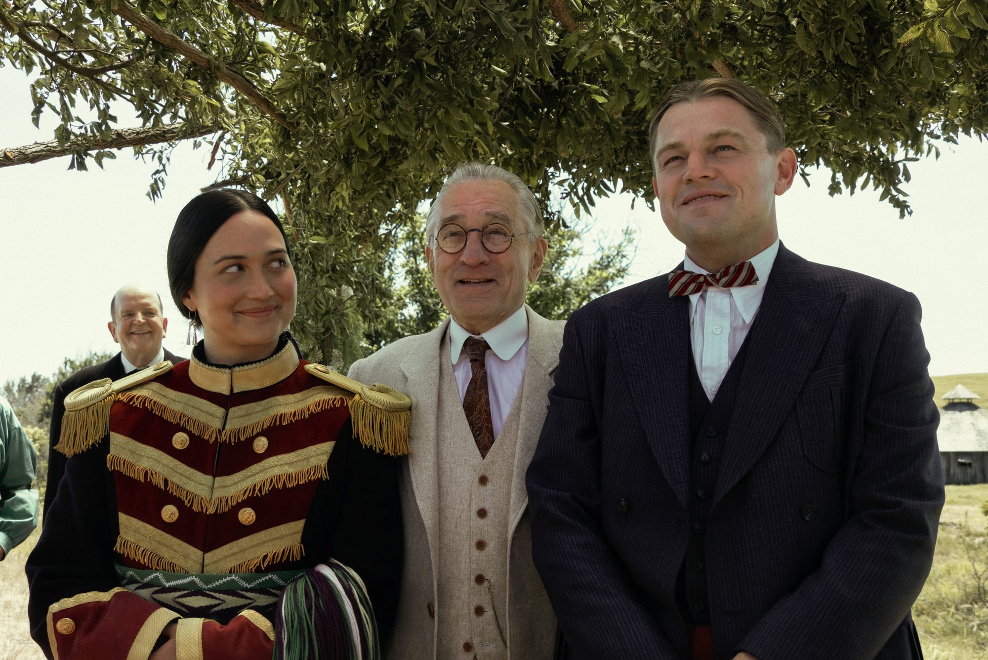 Lily Gladstone, Robert De Niro, and Leonardo DiCaprio star in a scene from “Killers of the Flower Moon.” (Apple TV+)