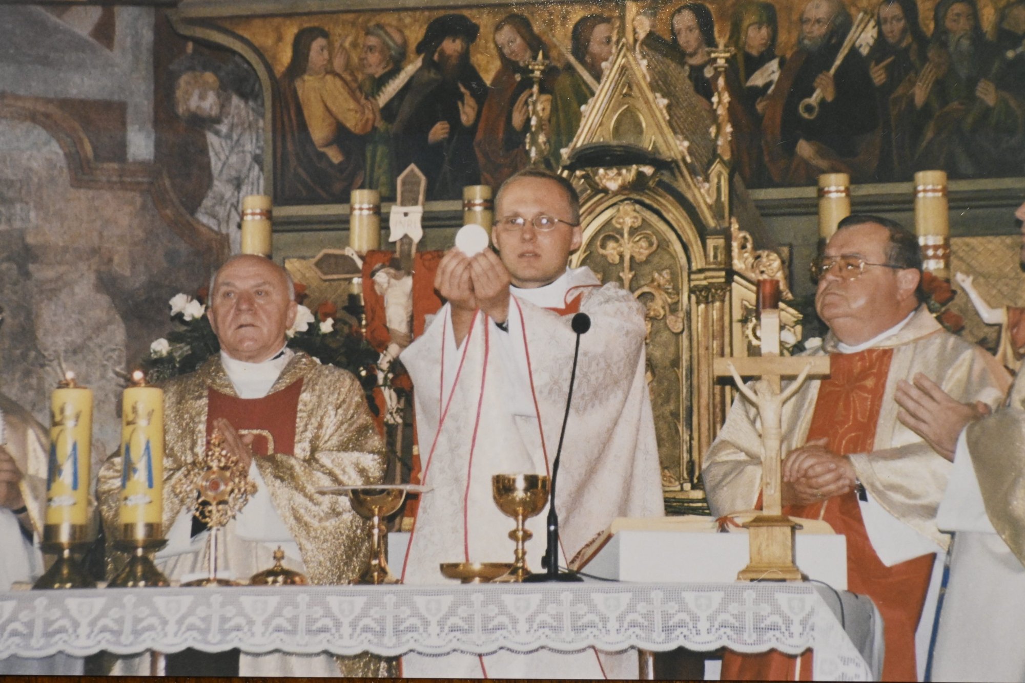 Father Slawomir Szkredka celebrates a first Mass at his home parish of St. Stanislaus in Bielsko-Biała, Poland, in 2002. At right is the late Msgr. William Leser, Szkredka’s friend and mentor who died last October. (Submitted photo)