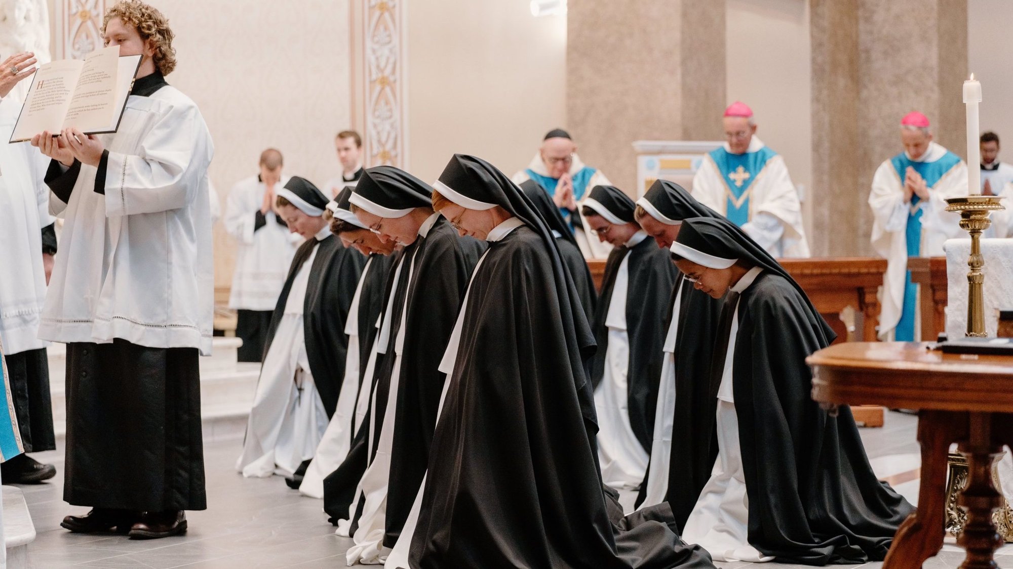 Twelve sisters kneel as they prepare to pronounce final vows with the Dominican Sisters of St. Cecilia Congregation in Nashville July 25, 2023. (OSV News/Rachel Lombardi, Tennessee Register)