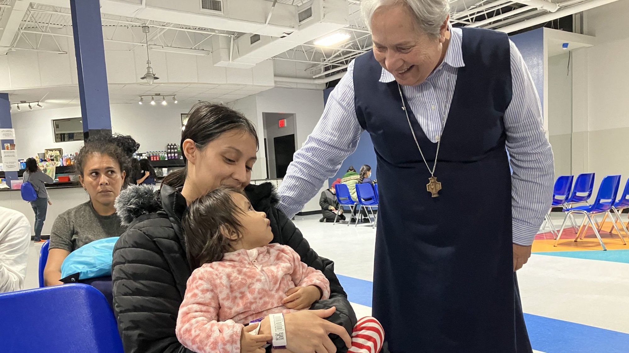 Sister Norma Pimentel, a Missionary of Jesus, greets Esther Chicas, a recently arrived migrant from El Salvador, and her child, Andrea, at the Humanitarian Respite Center in McAllen, Texas on Nov. 11, 2023. (OSV News/David Agren)