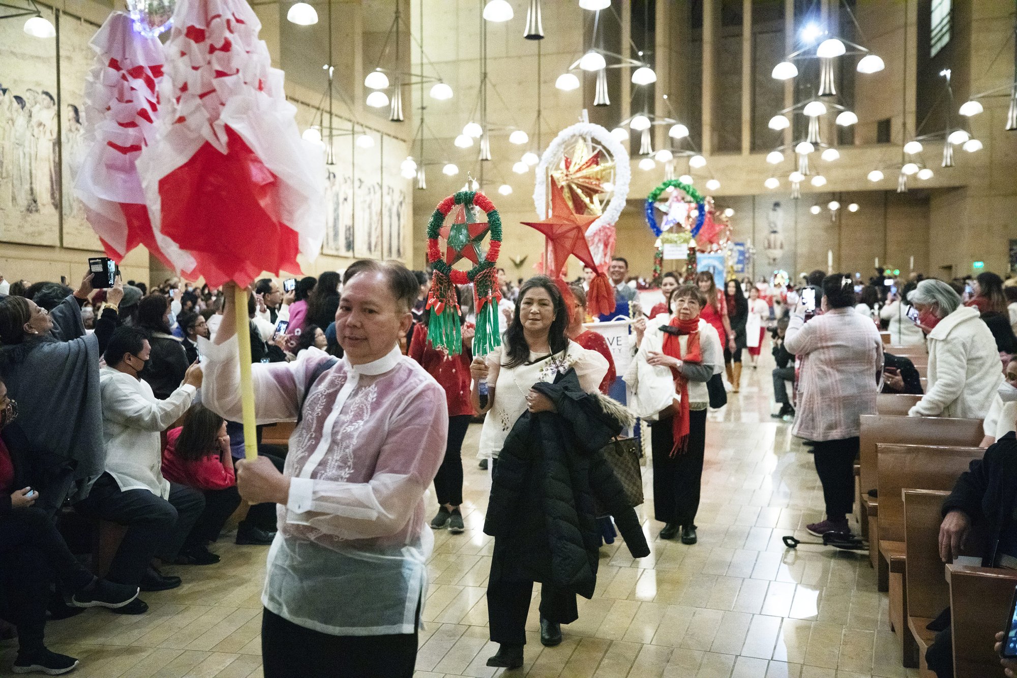 LA Catholics process into the Cathedral of Our Lady of the Angels for the 2022 Simbang Gabi kickoff Mass. (Victor Alemán)