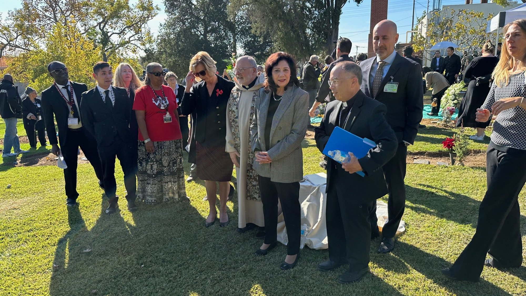 LA Auxiliary Bishop Brian Nunes, right, speaks during an interfaith burial ceremony at Evergreen Cemetery on Dec. 14. (Submitted photo)