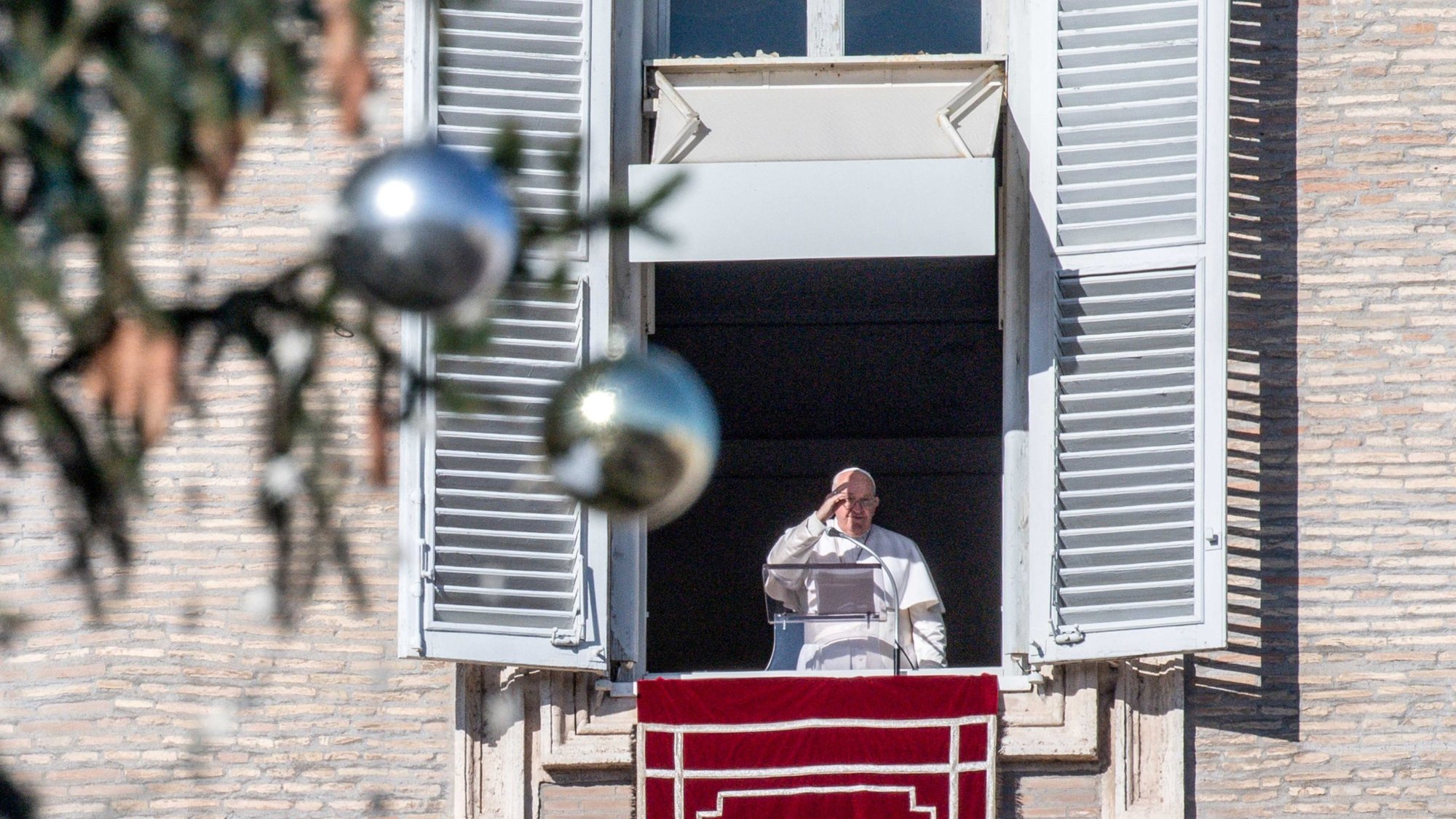 Pope Francis gives his blessing to visitors gathered in St. Peter's Square at the Vatican after praying the Angelus Dec. 10, 2023. (CNS photo/Vatican Media)