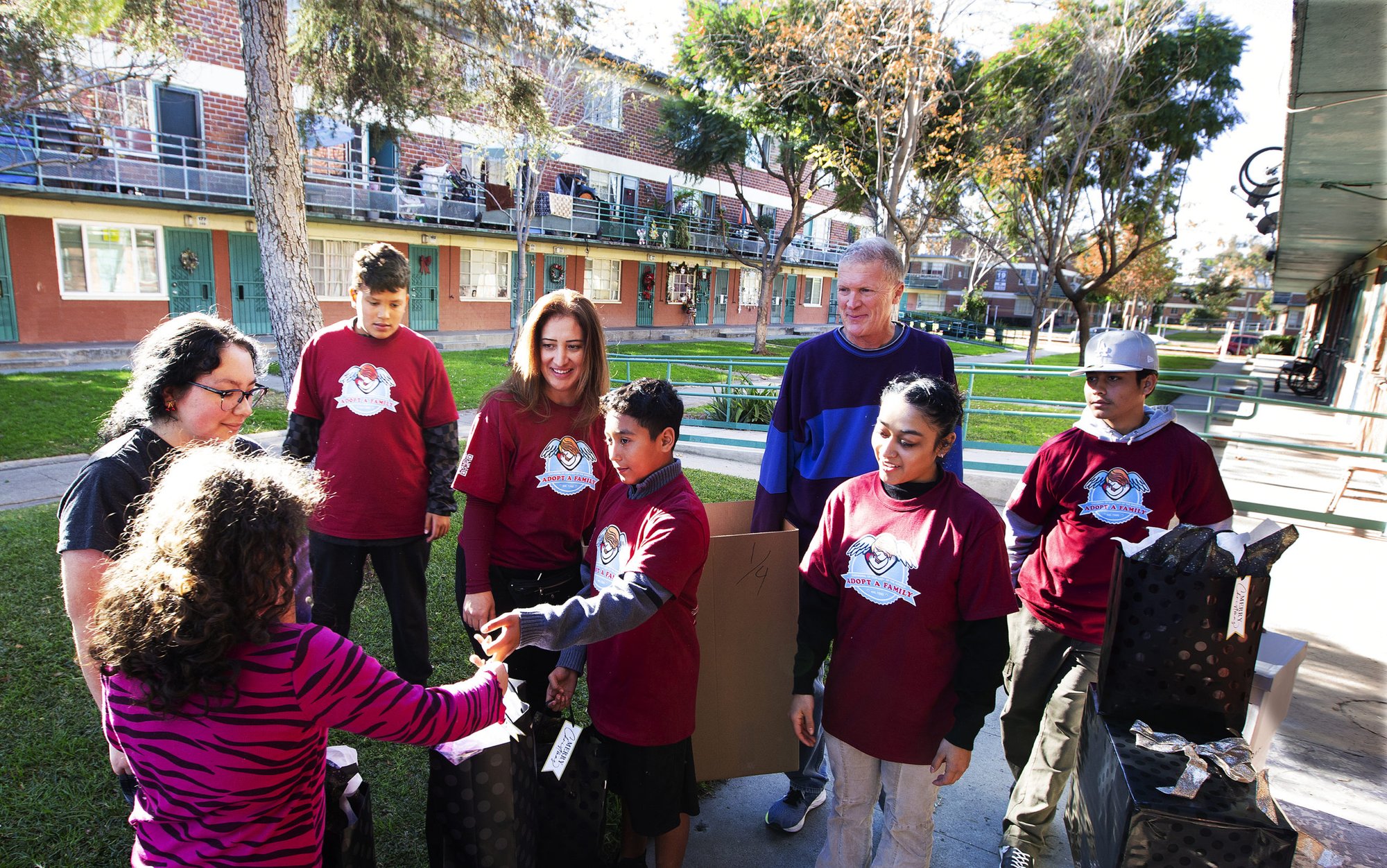 Volunteers drop off gifts for families on Dec. 16 as part of the Archdiocese of Los Angeles’ Adopt-a-Family program that began in 1990. (Victor Alemán)