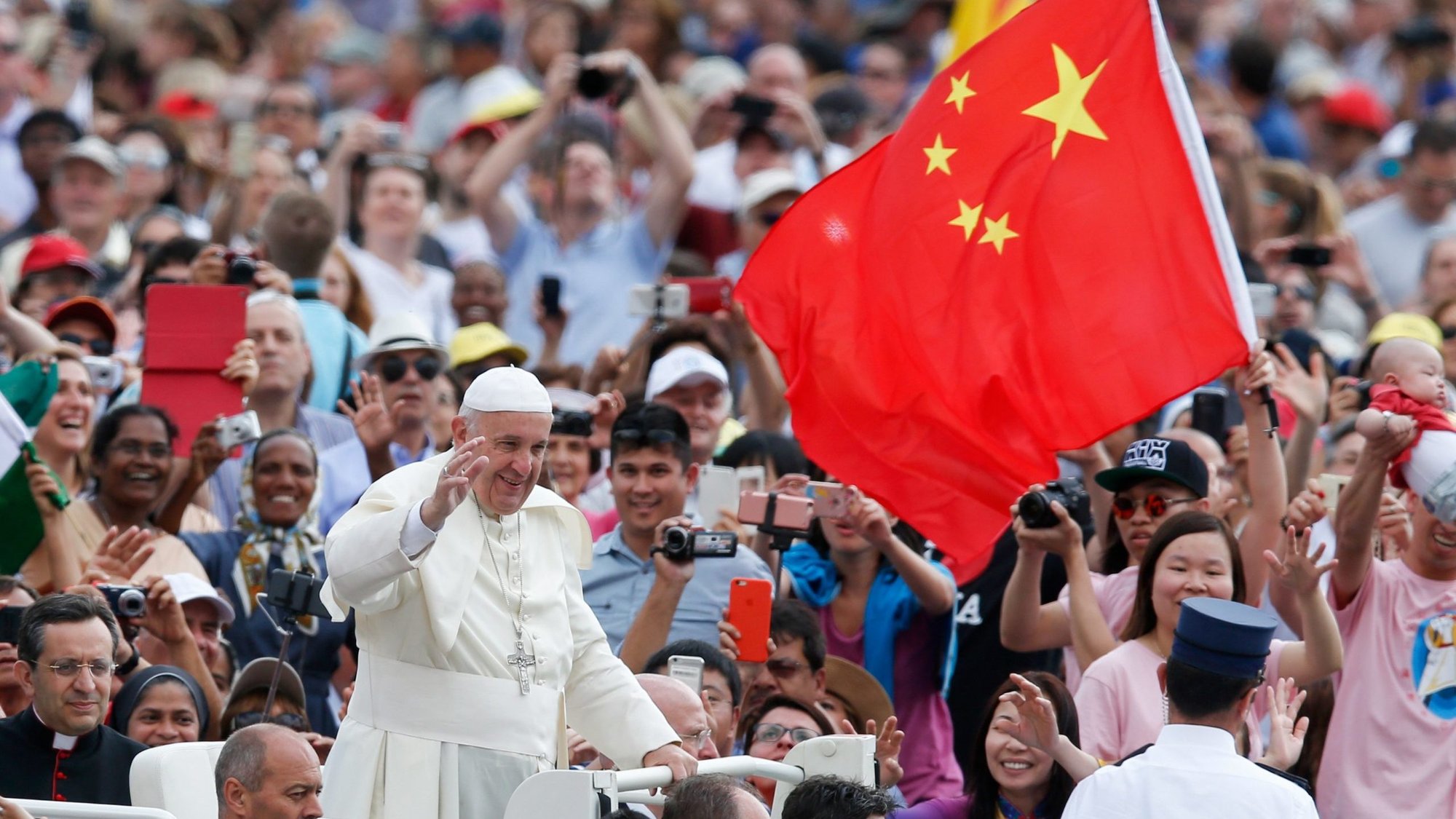 In this file photo, China's flag is seen as Pope Francis greets the crowd during his general audience in St. Peter's Square at the Vatican June 15, 2016. (CNS/Paul Haring)