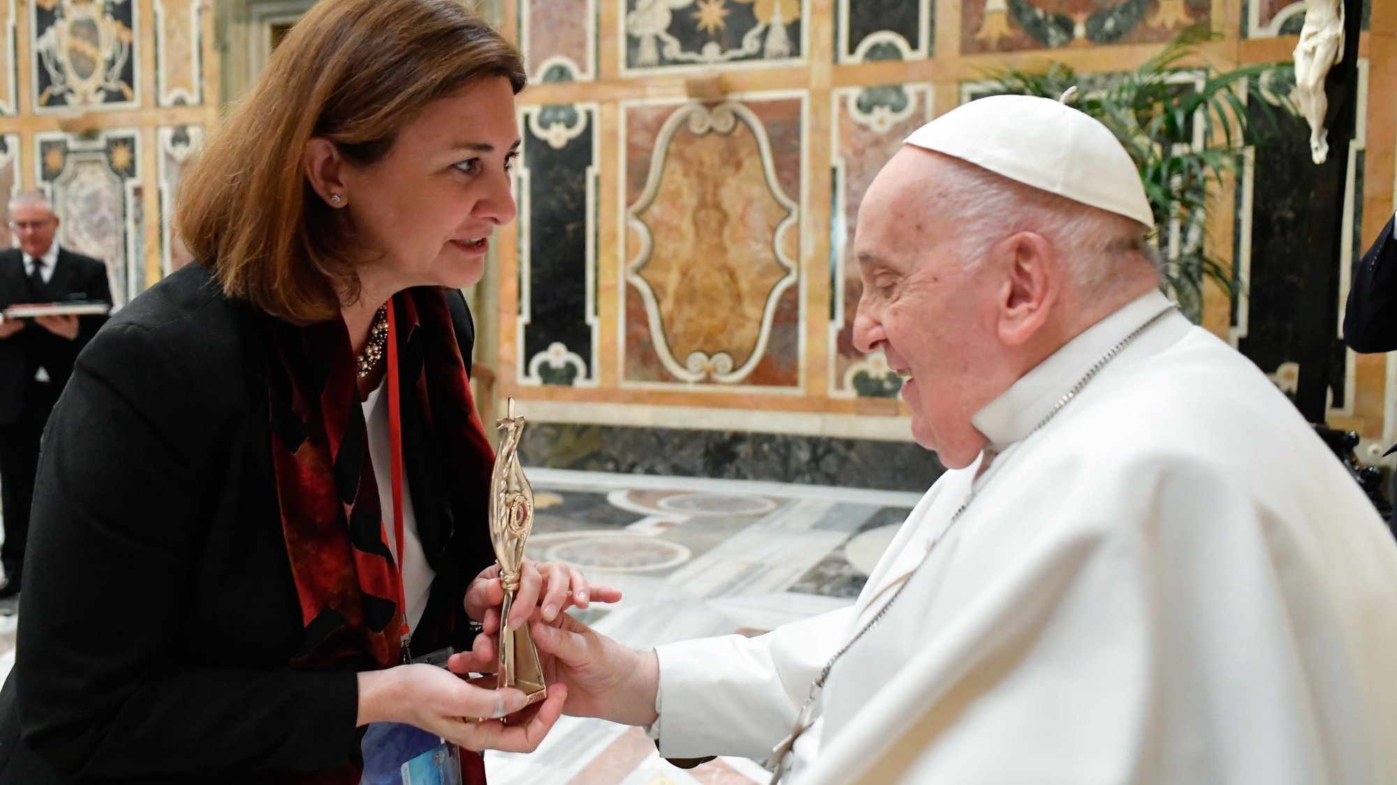 Gabriella Gambino, undersecretary of the Dicastery for Laity, the Family and Life, gives Pope Francis a reliquary at the end of a Vatican audience March 7, 2024, for people attending a two-day conference in Rome on "Women in the Church: Builders of Humanity." (CNS/Vatican Media)