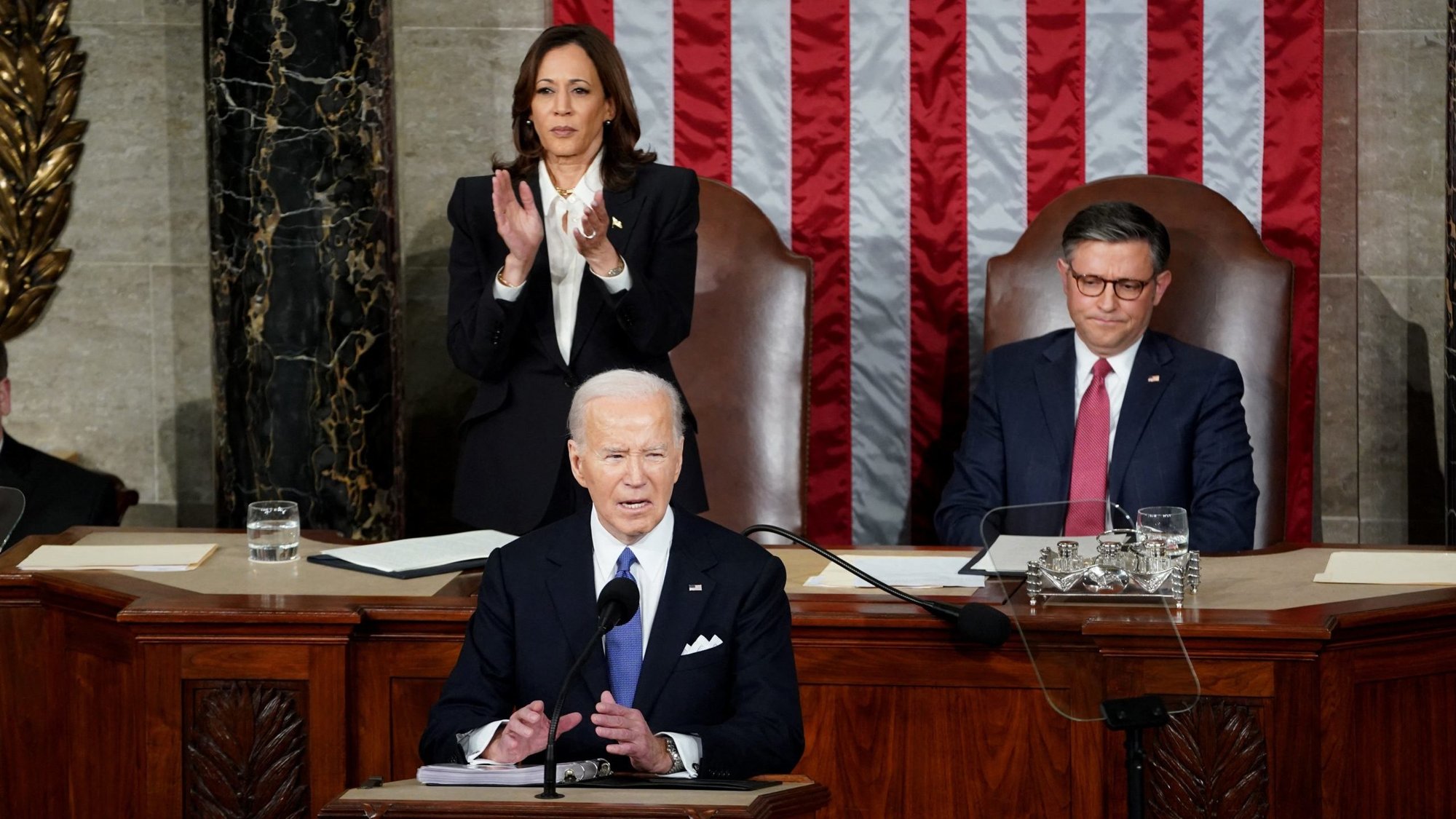 U.S. President Joe Biden delivers the State of the Union address at the U.S. Capitol in Washington March 7, 2024. In the background are Vice President Kamala Harris and House Speaker Mike Johnson, R-La. (OSV News/Shawn, Thew Reuters)