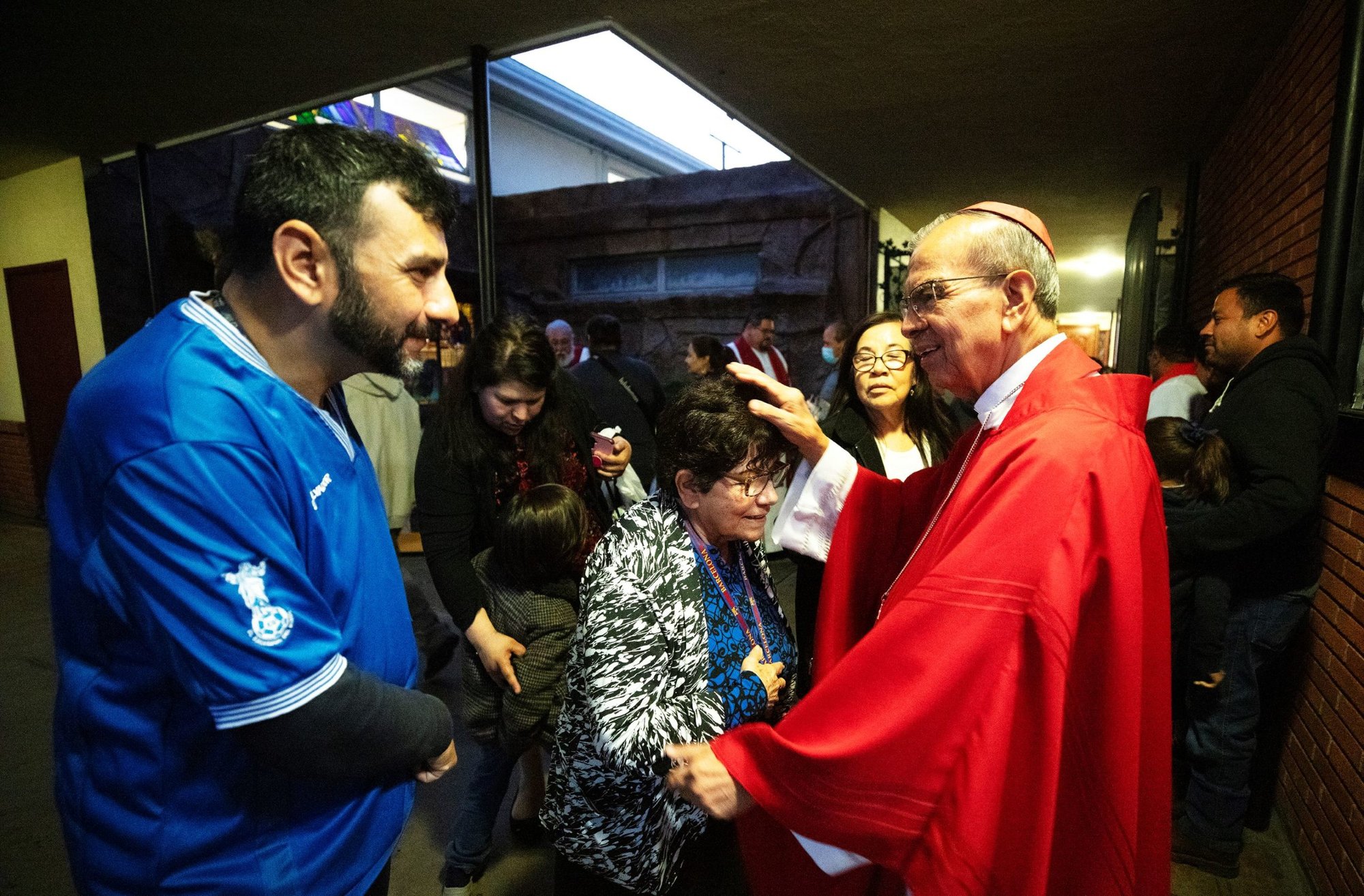 Cardinal Gregorio Rosa Chávez, emeritus auxiliary bishop of San Salvador, greets parishioners after Mass at St. Marcellinus Church in Commerce March 18. (Victor Alemán)