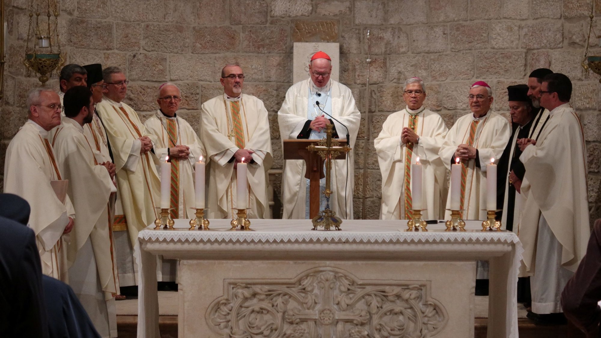 Cardinal Timothy M. Dolan of New York, center, offers Mass at the Our Lady of Peace chapel in the Notre Dame of Jerusalem Center April 13, 2024. The cardinal was reportedly safe in Jerusalem amid Iran's unprecedented missile and drone attacks on Israel that began later that evening. (OSV News photo/Sinan Abu Mayzer, Reuters)