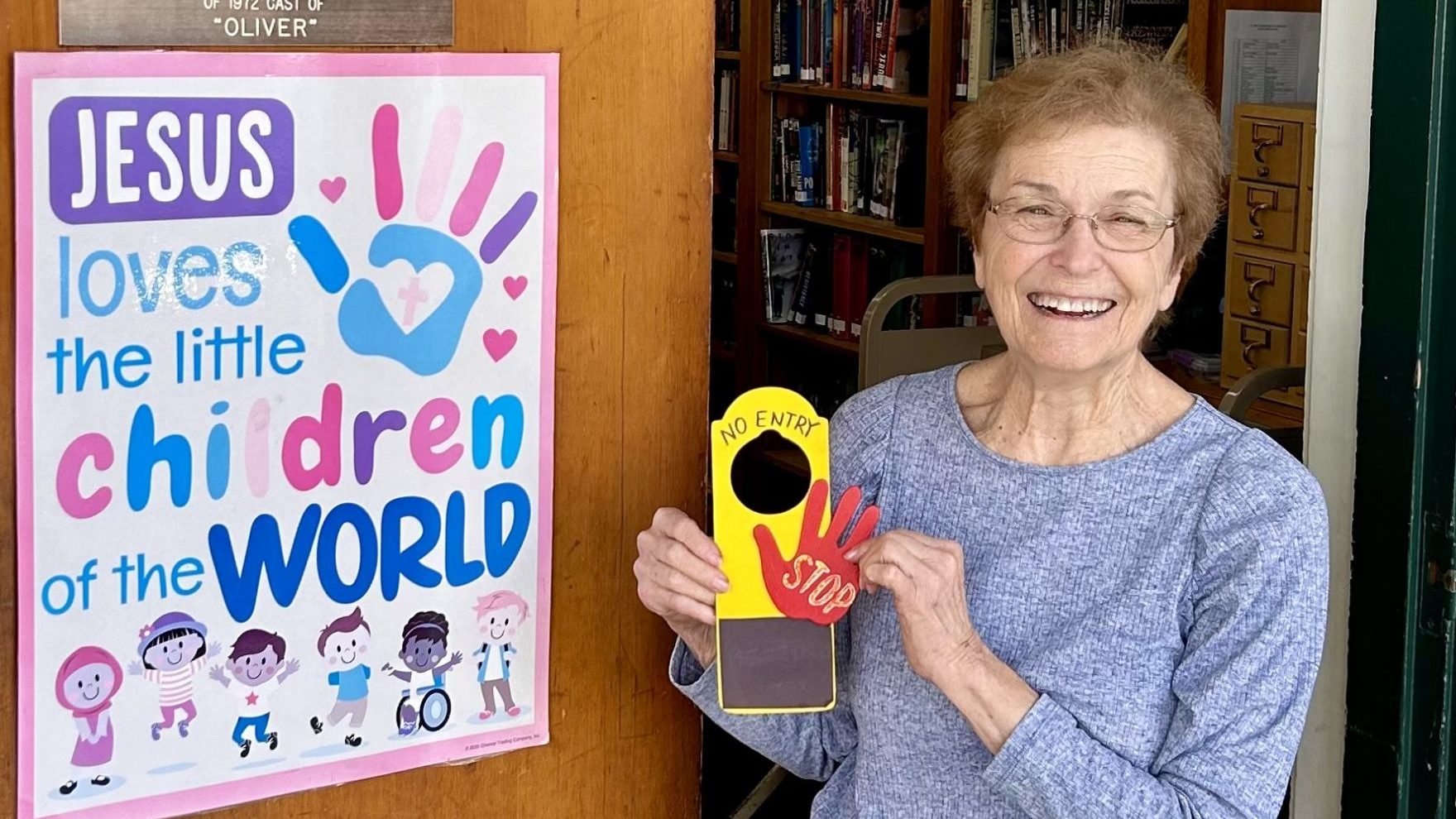 MaryLou Lia at the door of St. Cyril’s school library, where she’s worked for the last 43 years. (Tom Hoffarth)