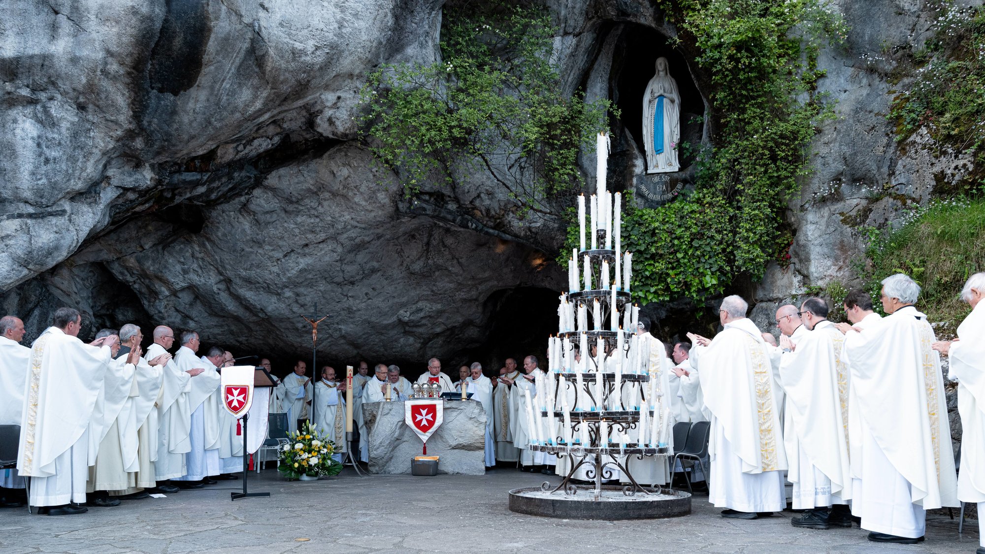 Archbishop José H. Gomez presides over a May 4 Mass with other bishops and priests at the Grotto of Massabielle in Lourdes. (Order of Malta Western (USA) Association, Inc.)