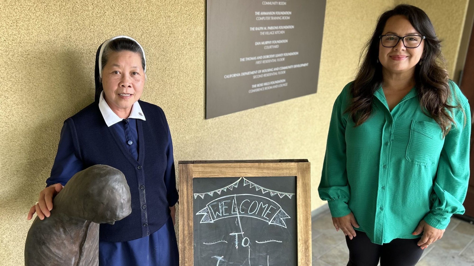 Program Director Sister Jennifer Nguyen, left, stands with Associate Director Elvia Valdes at Good Shepherd Center in Los Angeles’ Filipinotown. (Tom Hoffarth)