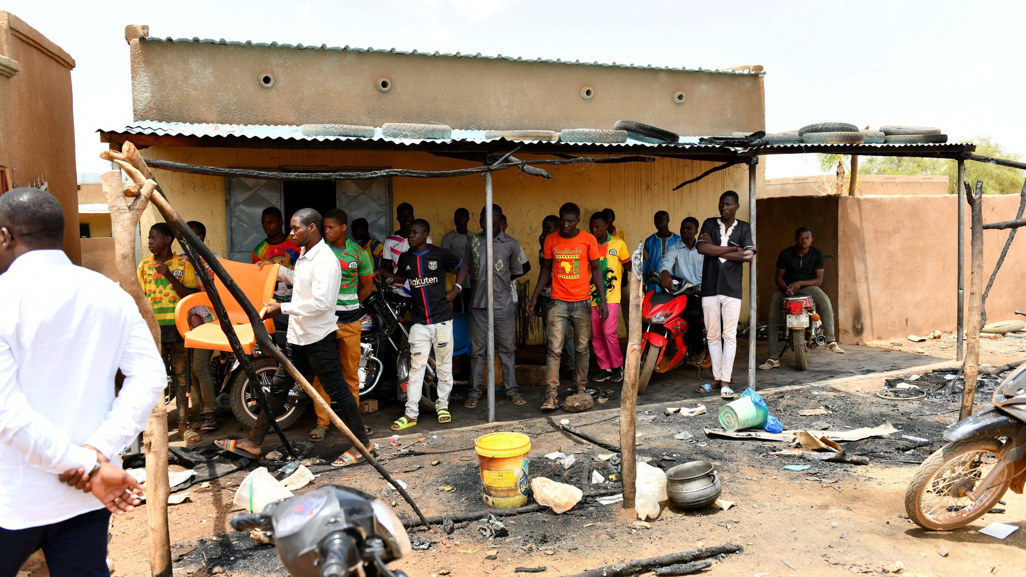 Residents gather June 7, 2021, at the site of an attack in the village of Solhan, Burkina Faso. Bishop Laurent Dabire of Dori condemned the June 5 attack by Islamists that left at least 160 people dead and urged residents to "keep faith and stay united." (CNS photo/Burkina Faso Prime Minister's Press Service handout via Reuters)