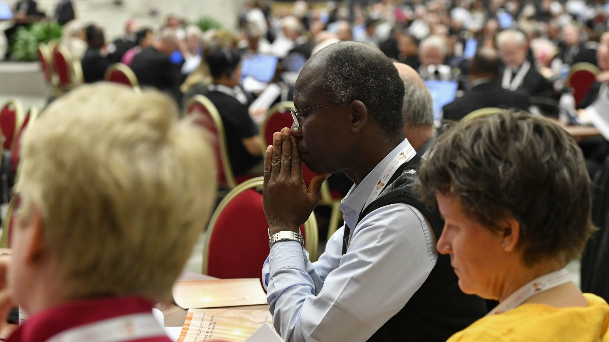Participants at the assembly of the Synod of Bishops recite morning prayer before finishing their discussions on the assembly's first module, which was on the meaning of synodality and how to promote it in the church, in the Vatican's Paul VI Audience Hall Oct. 7, 2023. (CNS photo/Vatican Media)