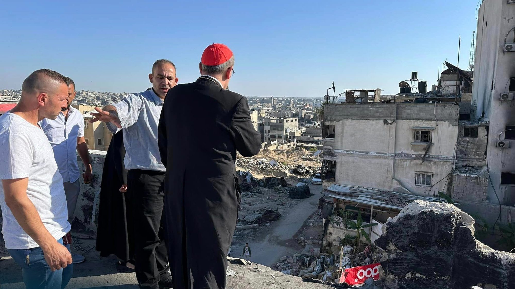 Cardinal Pierbattista Pizzaballa, Latin patriarch of Jerusalem, looks over the ruins of buildings in Gaza City. He visited northern Gaza Strip May 16-19, 2024, during Pentecost. At a press conference May 20 following his return to Jerusalem, he said he found the small resilient community of the Holy Family Parish compound in Gaza City to have "steadfast faith" amid horrific destruction and constant bombardment. (OSV News photo/courtesy Latin Patriarchate of Jerusalem)