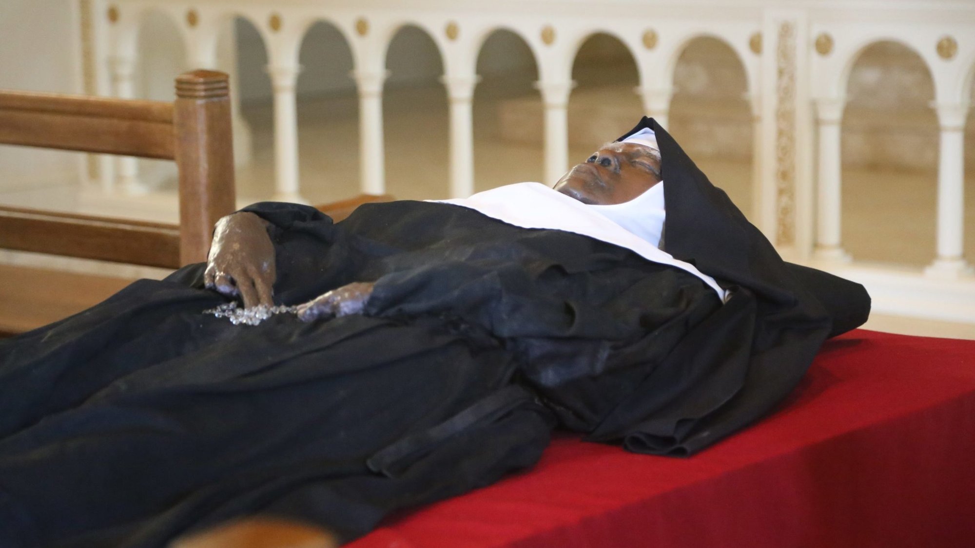 The apparently incorrupt body and religious habit of Sister Wilhelmina Lancaster, foundress of the Benedictines of Mary, Queen of Apostles, lies in repose in the church of the Abbey of Our Lady of Ephesus in Gower, Mo., May 21, 2023. An investigation by the Diocese of Kansas City-St. Joseph, Mo., found her body "does not appear to have experienced the decomposition that would have normally been expected under such previous burial conditions," according to an official diocesan announcement Aug. 22, 2024. (OSV News photo/Megan Marley)