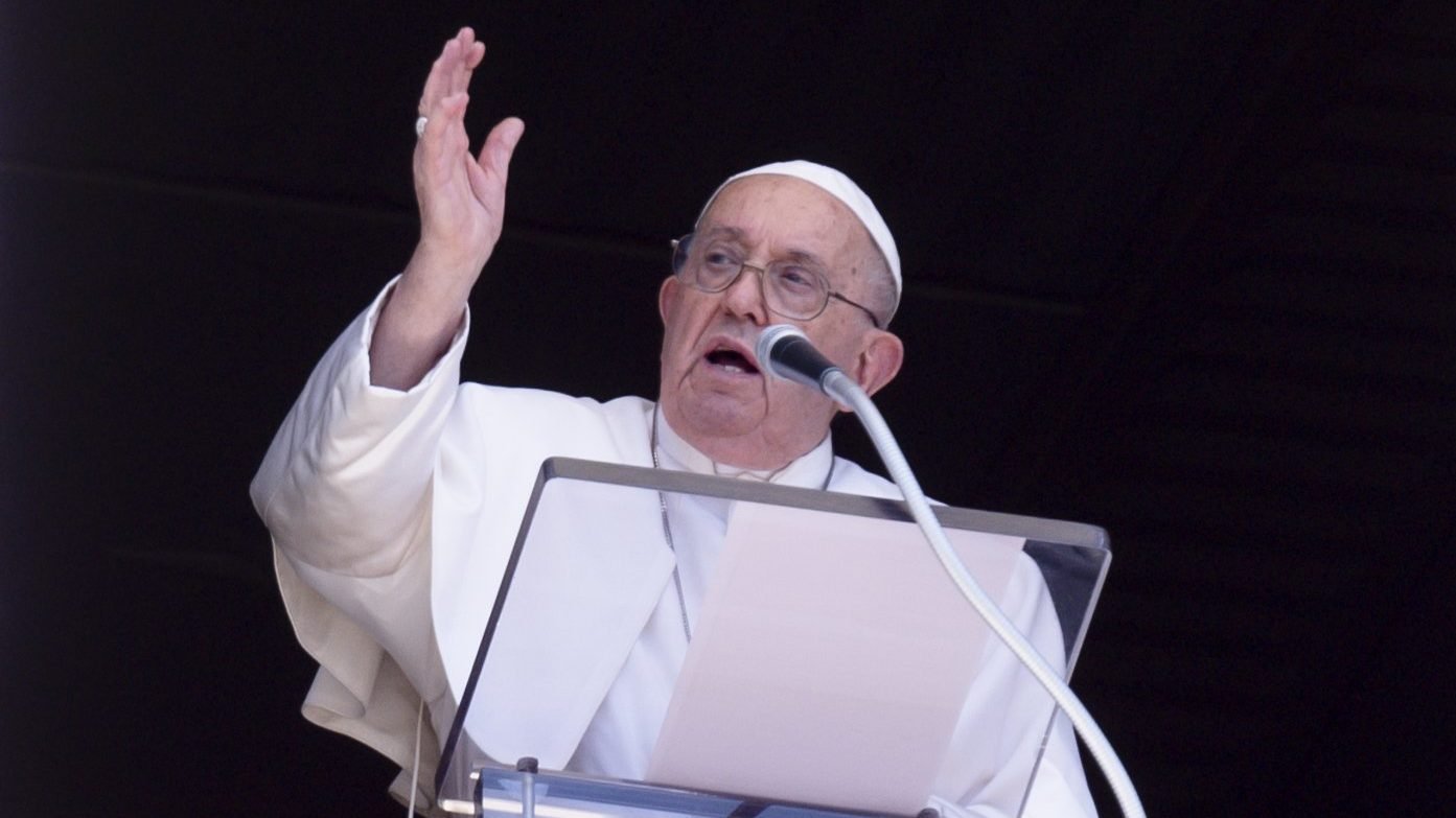 Pope Francis gives his blessing to visitors in St. Peter's Square at the Vatican after the midday recitation of the Angelus prayer Aug. 25, 2024. (CNS photo/Vatican Media)