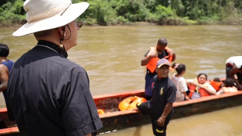 Bishop Mark J. Seitz of El Paso, Texas watches as migrants disembark at Lajas Blancas, Panama, amid their journey through that nation's Darién Gap, during the bishop's pastoral visit amid the 10th Meeting of Bishops and Migration Pastoral Agents of North America, Central America and the Caribbean, which took place Aug. 19-23 in Panama. (OSV News photo/courtesy of Bishop Mark J. Seitz) Editors: best quality available.