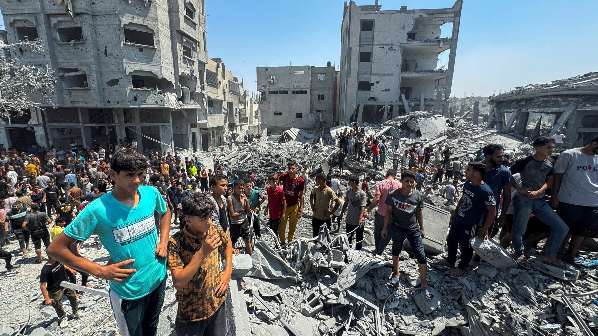 Palestinians react at the site of an Israeli airstrike that destroyed several houses, amid Israel-Hamas conflict, in Khan Younis in the southern Gaza Strip Aug. 27, 2024. (OSV News photo/Mohammed Salem, Reuters)