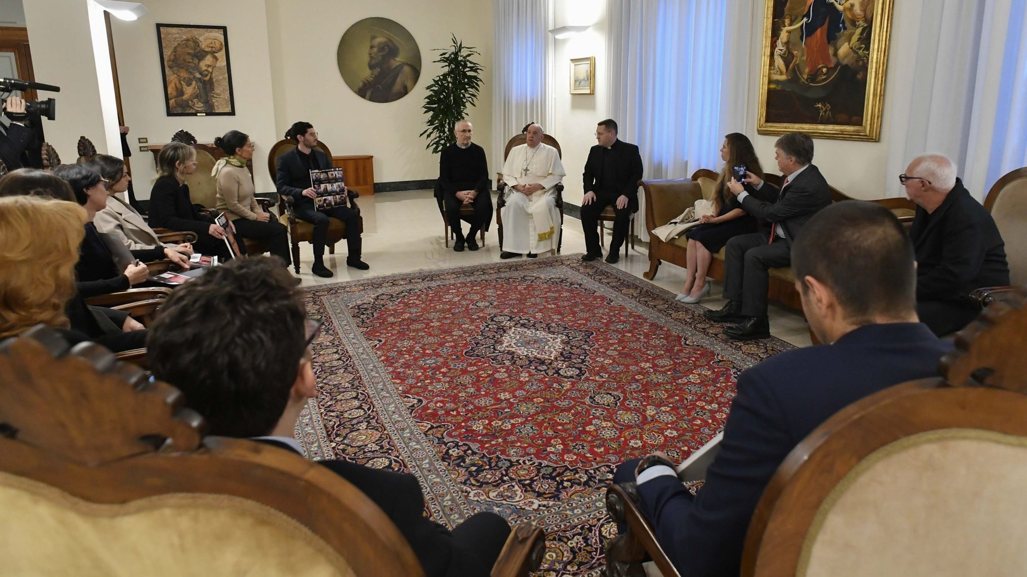 Pope Francis meets relatives of hostages taken by Hamas militants from Israel Oct. 7 in his residence, the Domus Sanctae Marthae, at the Vatican Nov. 22, 2023. Members of the delegation carried posters of their loved ones. (CNS photo/Vatican Media)