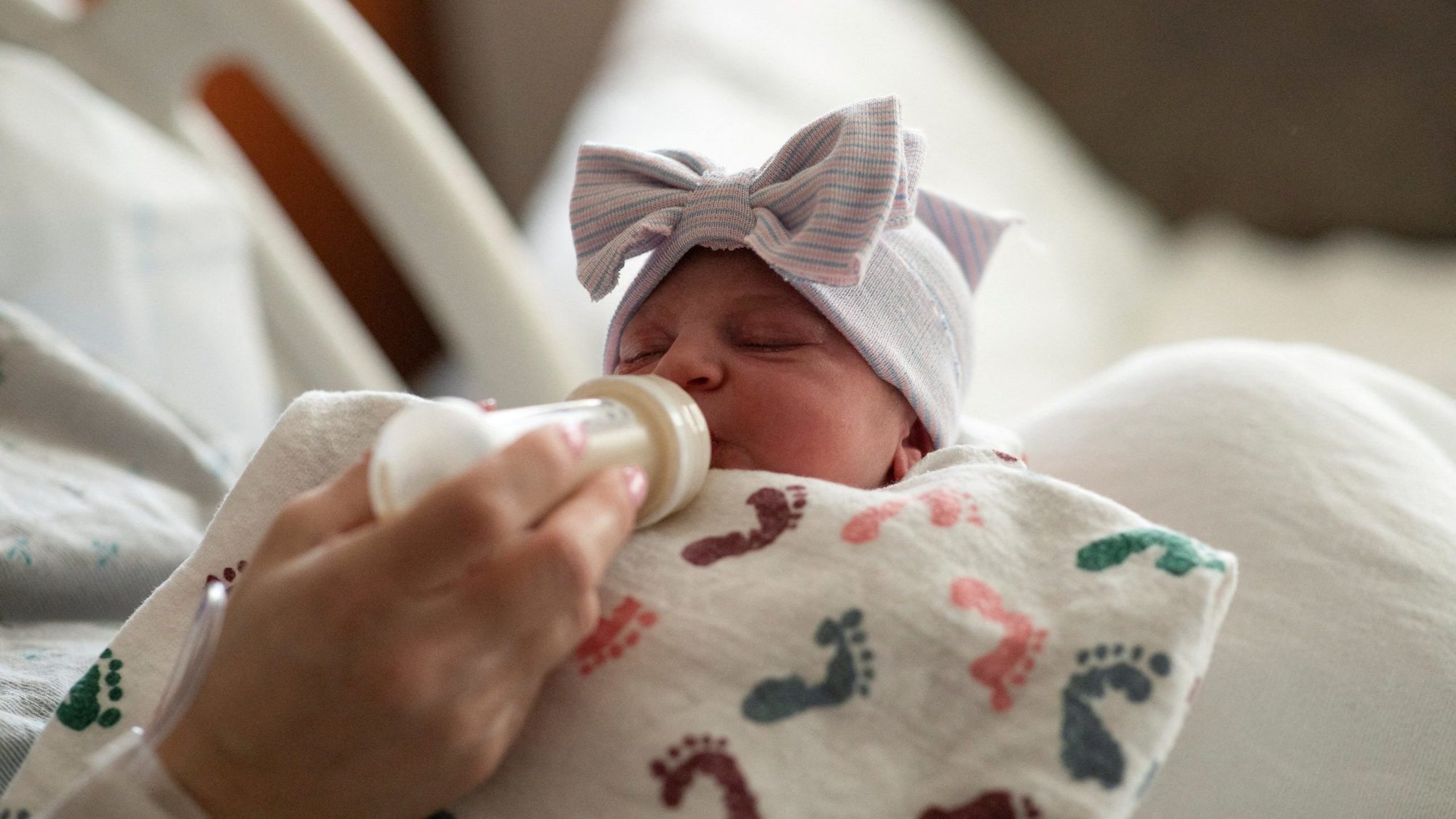A mother feeds her newborn child, after giving birth in the Family Birth Center at Beaumont Hospital in Royal Oak, Mich., Feb. 1, 2022. Vice President Kamala Harris has suggested a robust increase in the child tax credit, while Ohio Sen. JD Vance has floated a similar proposal; some pro-life leaders say the initiatives, if passed by Congress, could help reduce poverty and aid some low-income parents in choosing life. (OSV News photo/Emily Elconin, Reuters)