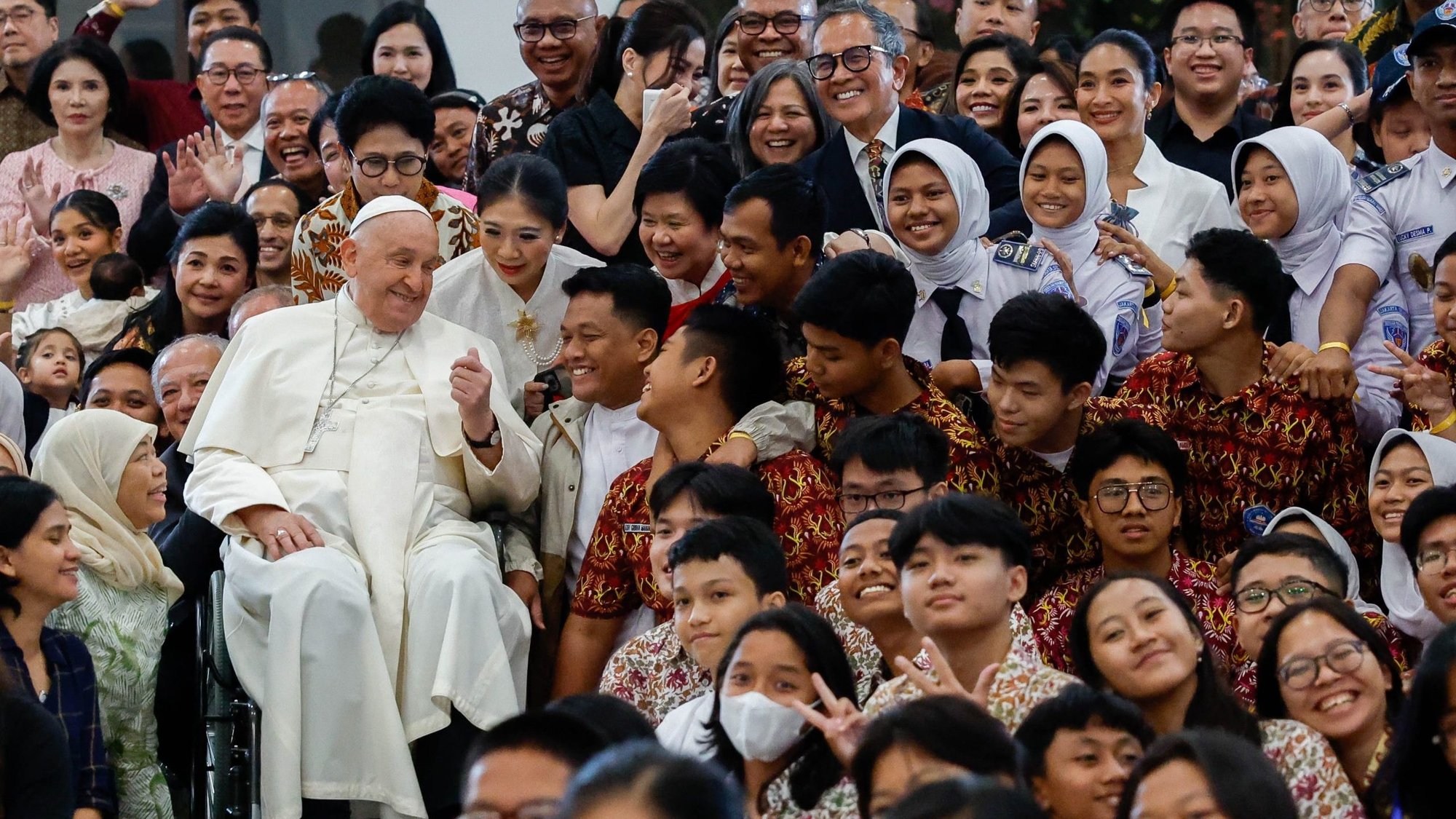 Pope Francis shares a moment with young people from Scholas Occurrentes at the Grha Pemuda Youth Center in Jakarta, Indonesia, Sept. 4, 2024. (CNS photo/Lola Gomez)