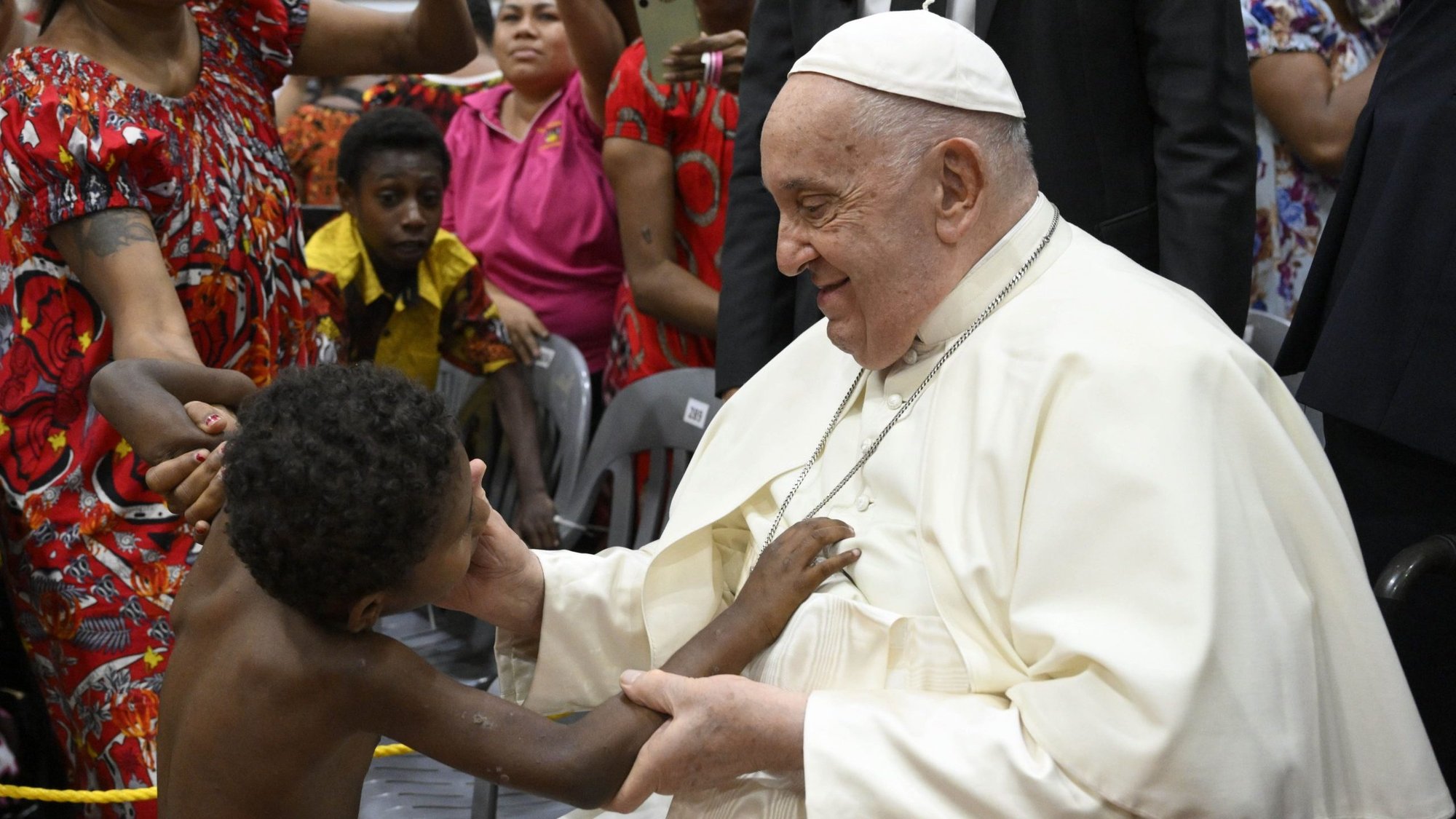 Pope Francis greets a boy during a meeting with children in need at the Caritas Technical Secondary School in Port Moresby, Papua New Guinea, Sept. 7, 2024. (CNS photo/Vatican Media)