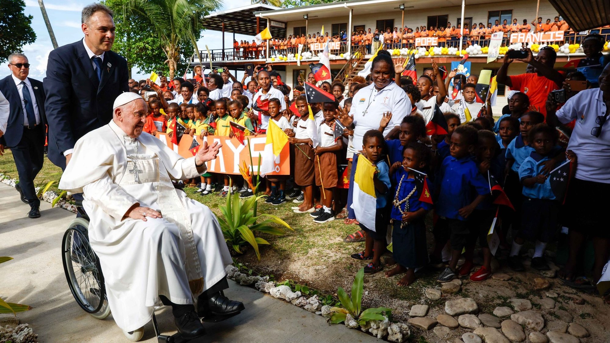 Pope Francis is welcomed by children and missionaries at the Queen of Paradise School and Hall in Baro, Papua New Guinea, Sept. 8, 2024. (CNS photo/Lola Gomez)