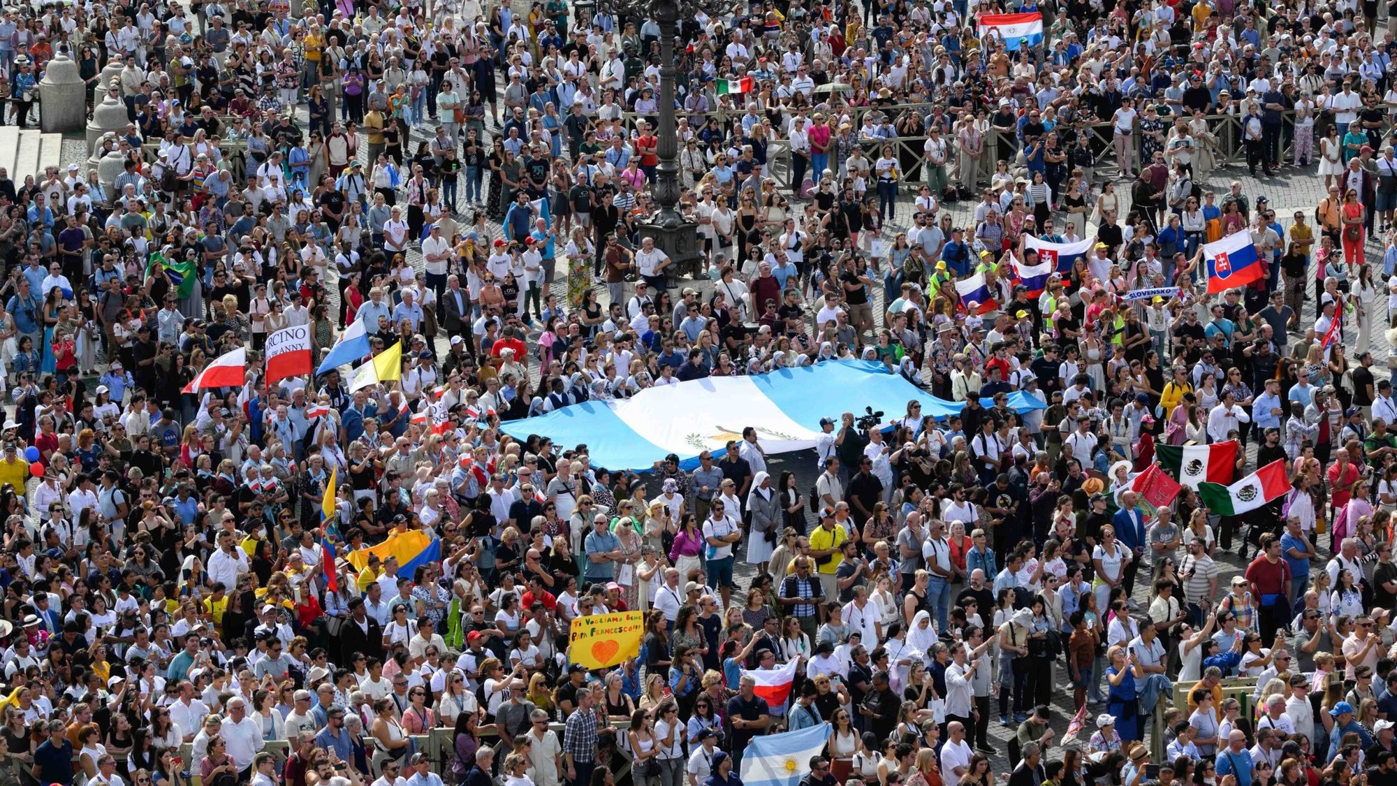 Visitors gather in St. Peter's Square to pray the Angelus with Pope Francis at the Vatican Sept. 22, 2024. (CNS photo/Vatican Media)