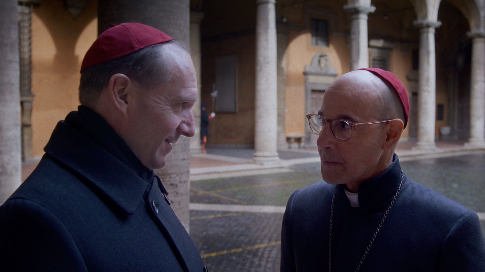 Ralph Fiennes as Cardinal Lawrence, and Stanley Tucci as Cardinal Bellini, star in a scene from the movie “Conclave.” (Courtesy Focus Features)