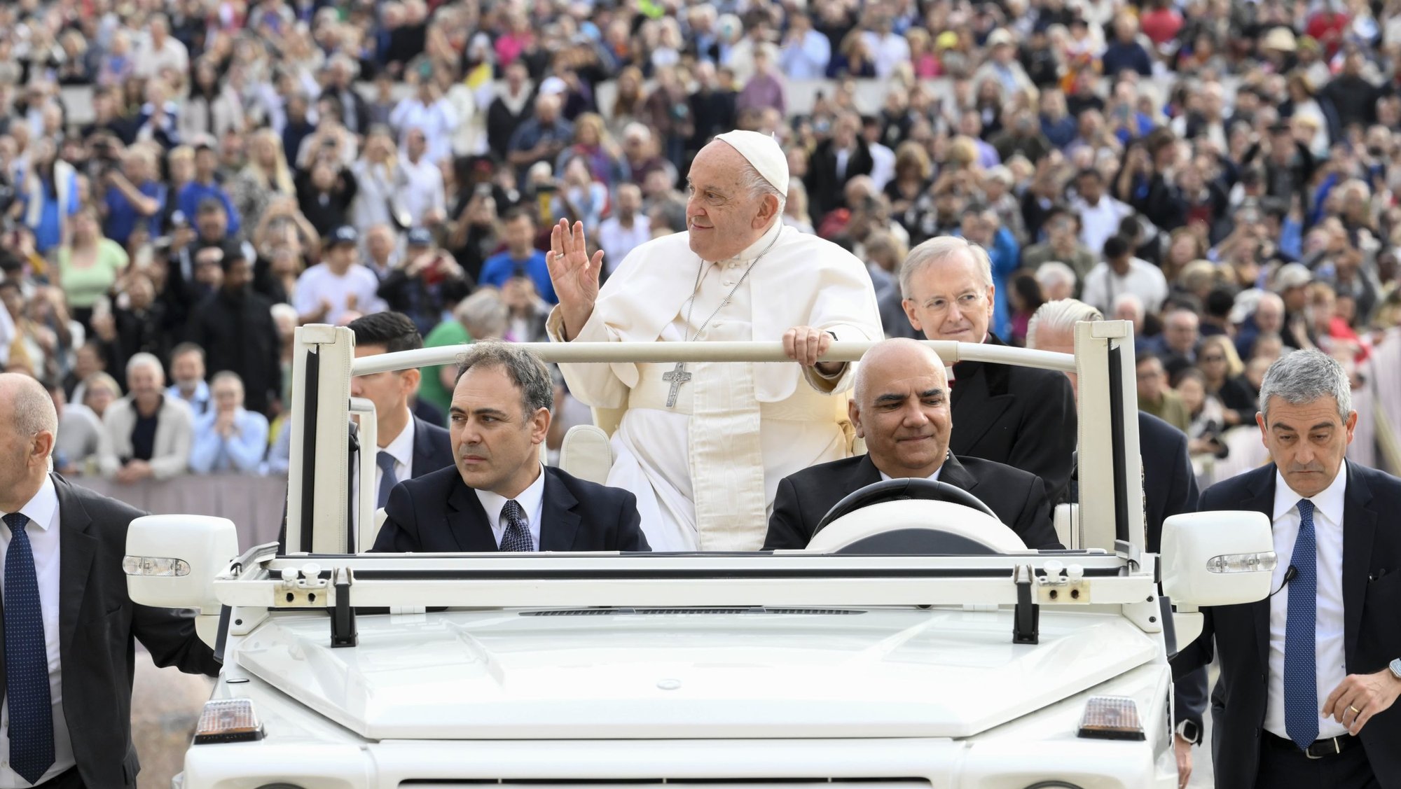 Pope Francis waves to visitors while riding the popemobile around St. Peter's Square before his general audience at the Vatican Oct. 16, 2024. (CNS photo/Vatican Media)
