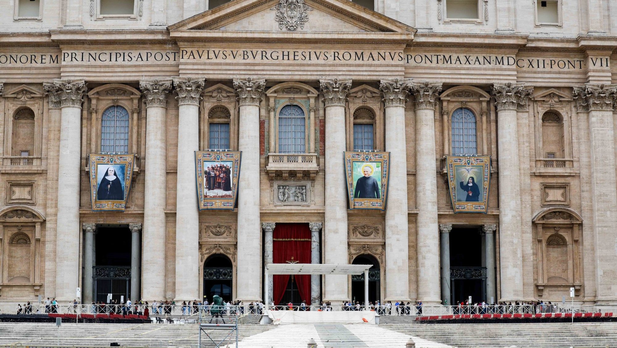 Banners of soon-to-be saints hang from the facade of St. Peter's Basilica at the Vatican Oct. 17, 2024. From the left, the banners depict: Canada-born Blessed Marie-Léonie Paradis, founder of the Little Sisters of the Holy Family; eight Franciscan friars and three Maronite laymen martyred in Syria in 1860; Blessed Giuseppe Allamano, founder of the Consolata Missionaries; and Blessed Elena Guerra, founder of the Oblates of the Holy Spirit. (CNS photo/Lola Gomez)