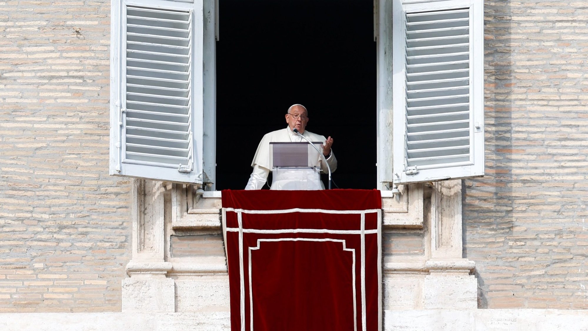Pope Francis speaks to visitors gathered in St. Peter's Square before praying the Angelus at the Vatican Oct. 27, 2024. (CNS photo/Lola Gomez)