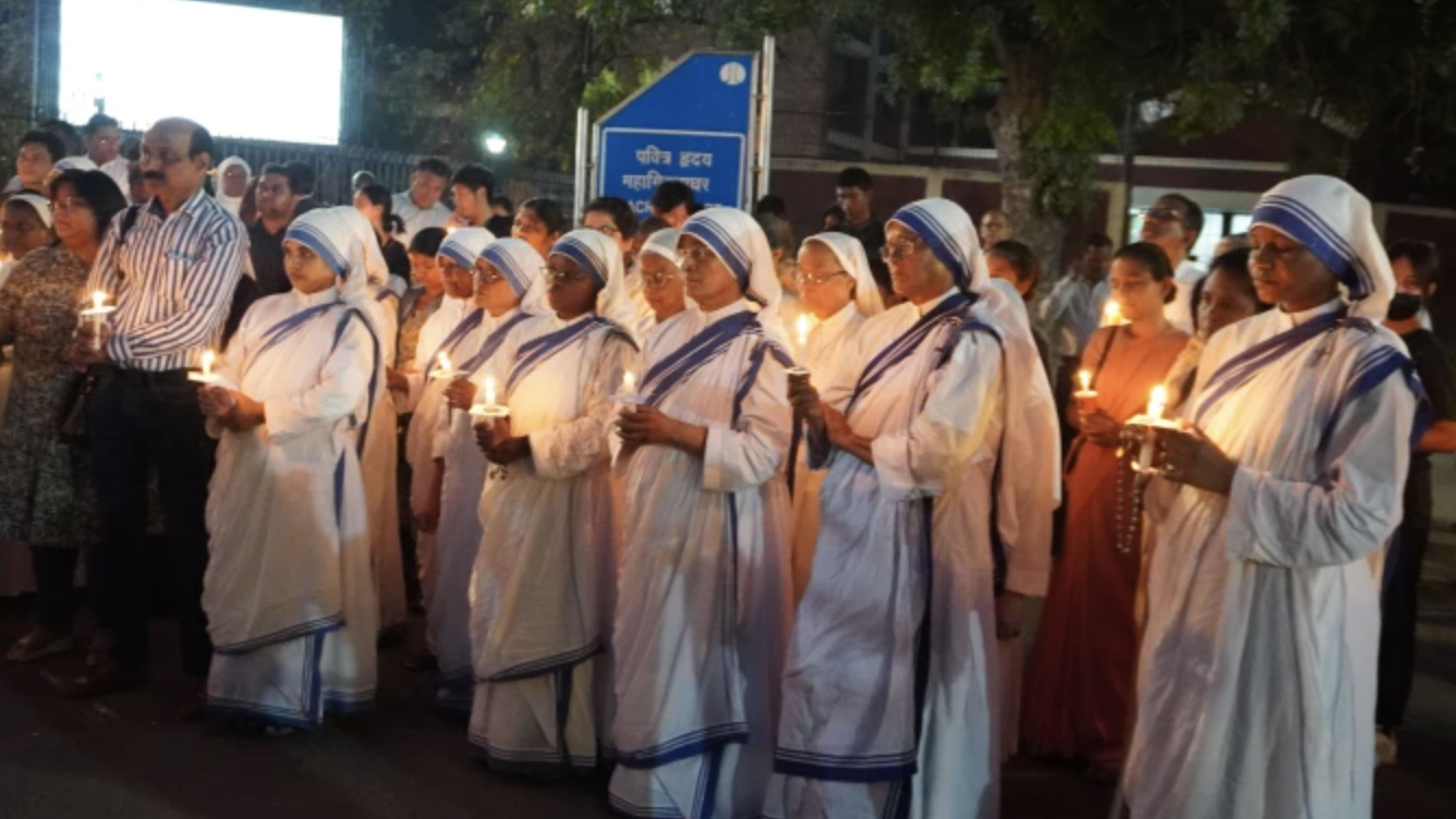 Nuns from the Missionaries of Charity hold candles in recognition of the May 3 annivesary of ethnic violence in Manipur, India. (Anto Akkara via CNA)