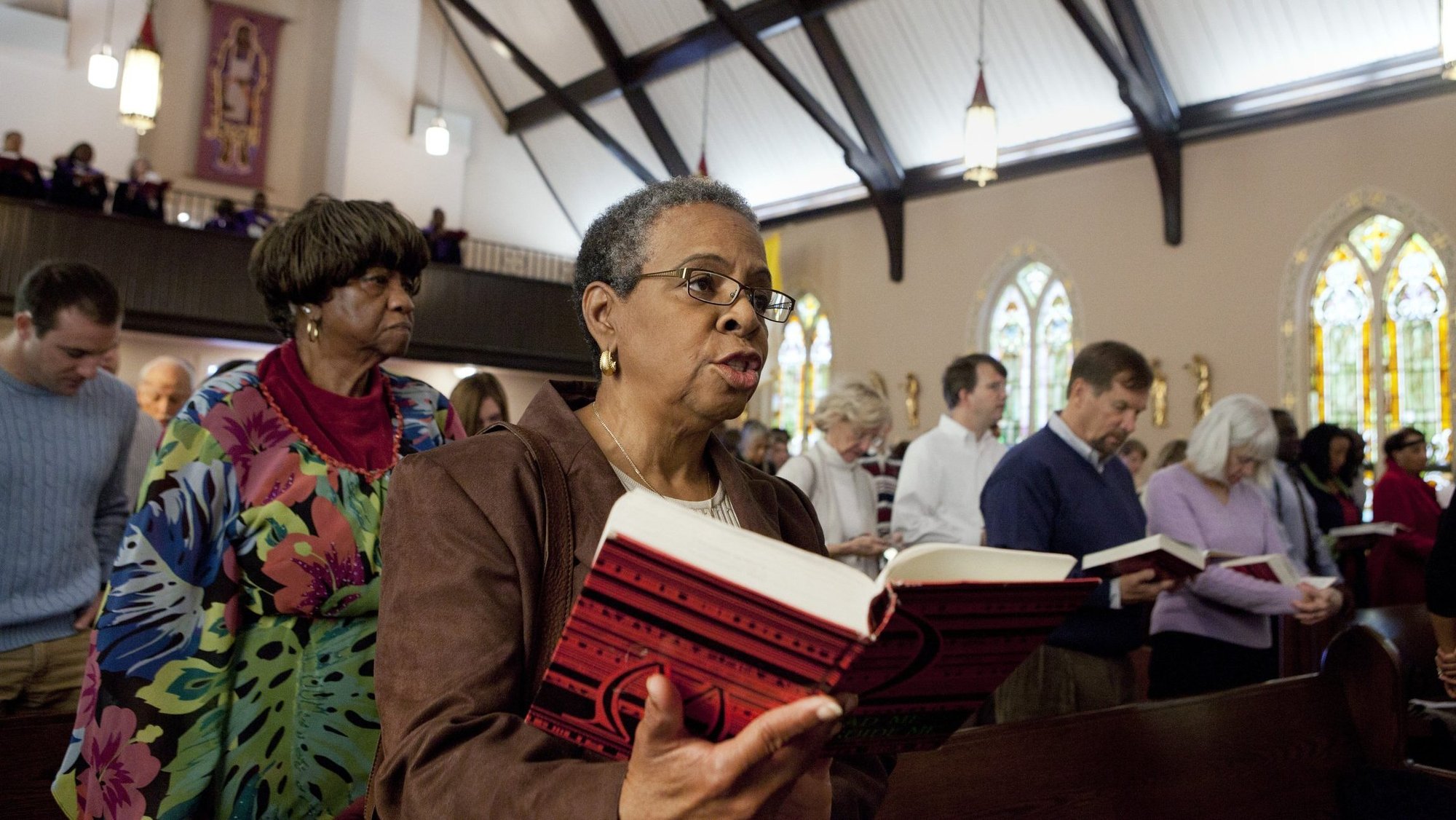 A woman is pictured in a file photo singing the closing hymn during Sunday Mass at St. Joseph's Catholic Church in Alexandria, Va. (OSV News photo/Nancy Phelan Wiechec)