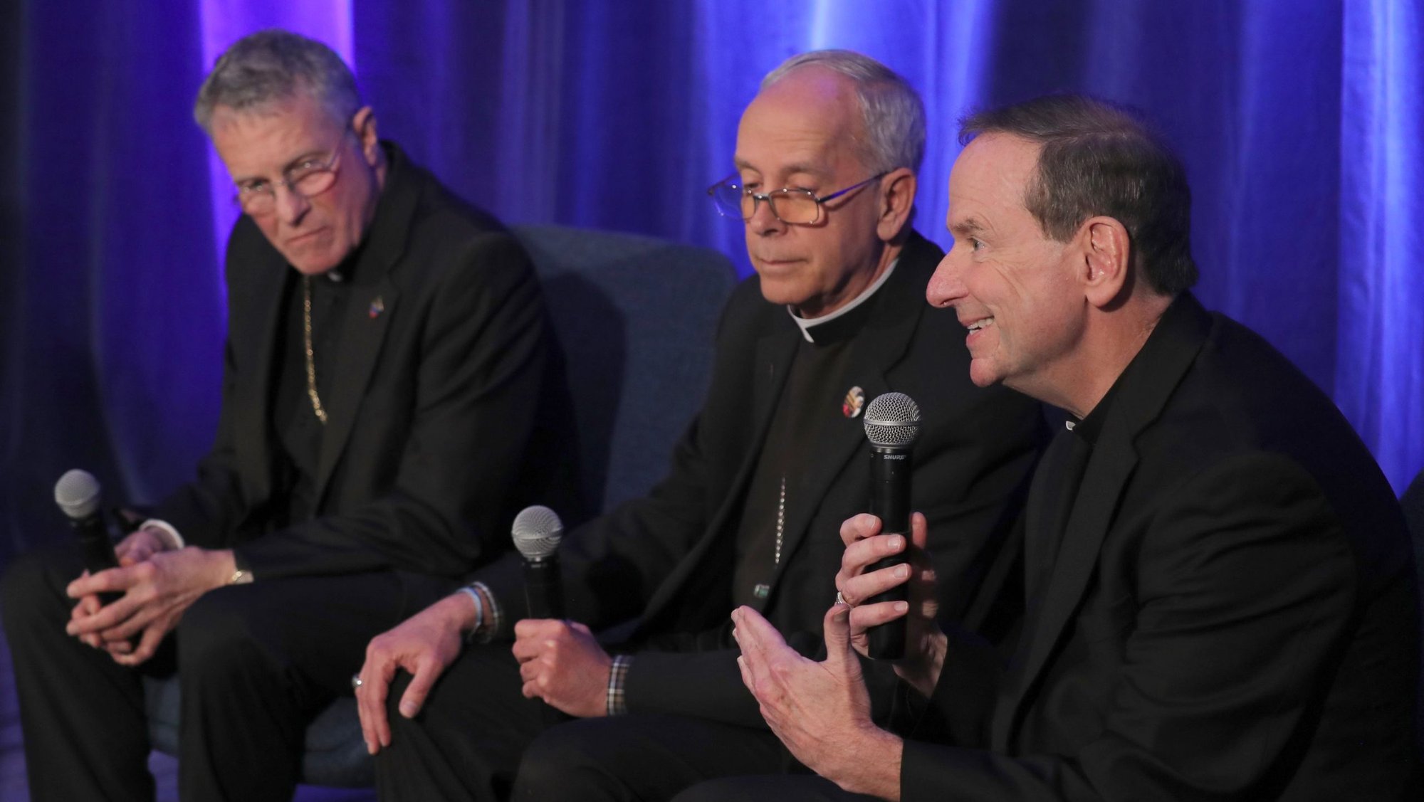 Bishop Michael F. Burbidge of Arlington, Va., gestures during a news conference at a Nov. 12, 2024, session of the fall general assembly of the U.S. Conference of Catholic Bishops in Baltimore. Also pictured are Archbishop Timothy P. Broglio of the U.S. Archdiocese for the Military Services, president of the USCCB, and Bishop Mark J. Seitz of El Paso, Texas. (OSV News photo/Bob Roller)