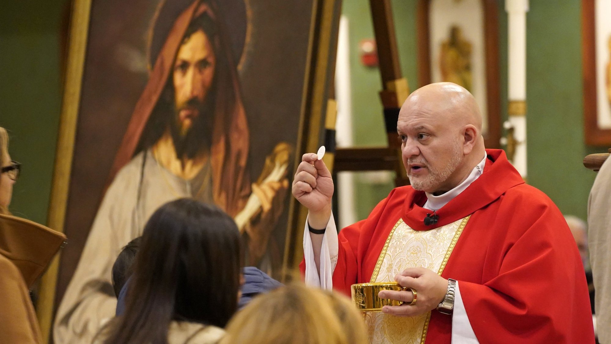 Father Carlos Martins, a member of the Companions of the Cross religious community, distributes Communion during a special Mass celebrated in honor of St. Jude the Apostle at St. Jude Church in Mastic Beach, N.Y., Nov. 27, 2023. A tour of a relic of St. Jude conducted by Father Martins was halted Nov. 21 following an alleged "incident" involving students, according to a statement from Queen of Apostles parish in the Diocese of Joliet, Illinois and from the diocese. (OSV News photo/Gregory A. Shemitz)